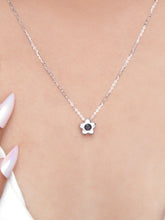 925 silver flower pendant necklace with black stone centerpiece on a fine chain