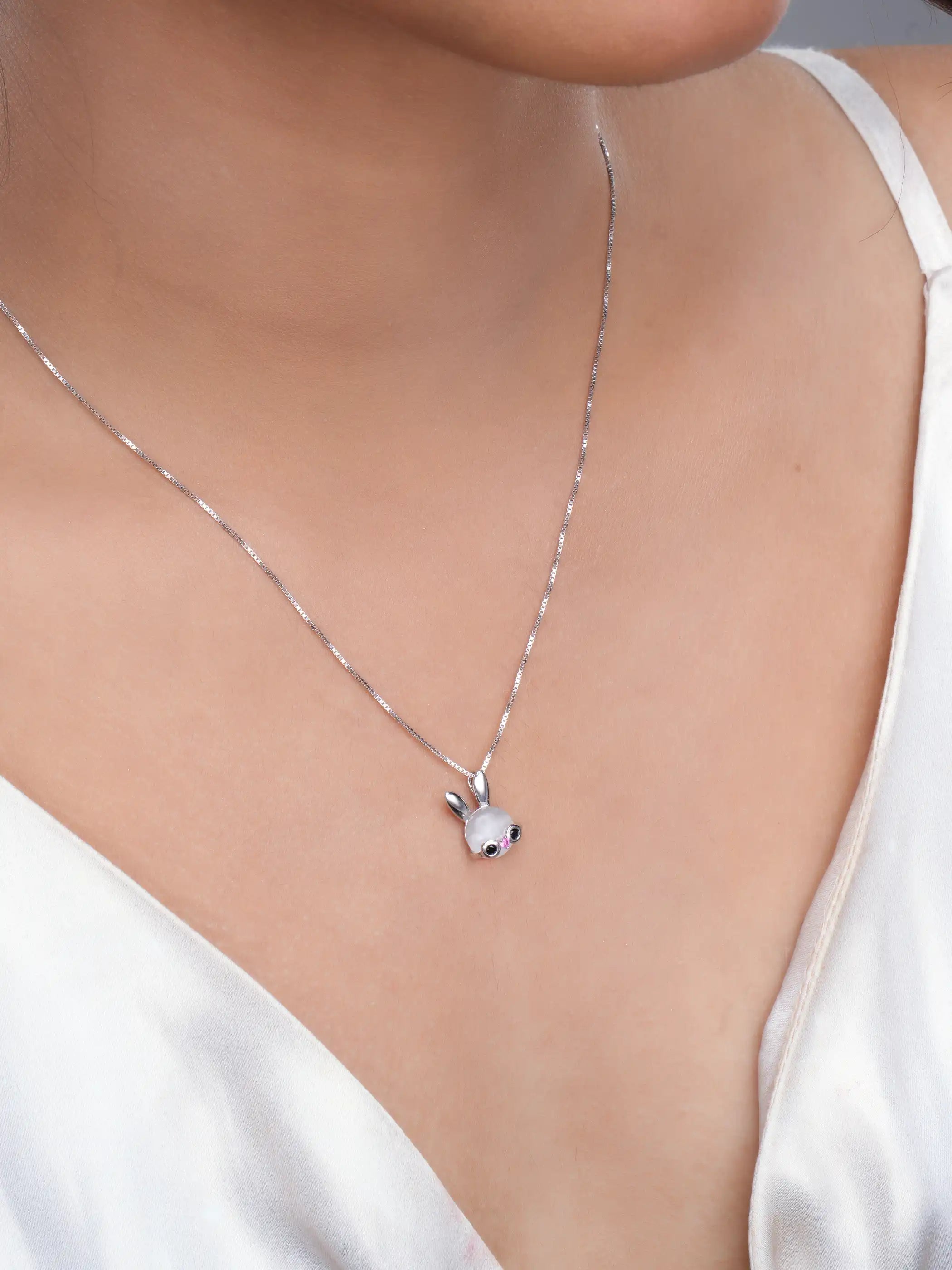925 silver pendant necklace with bunny motif featuring pearl detail and pink gemstone eyes on sleek chain