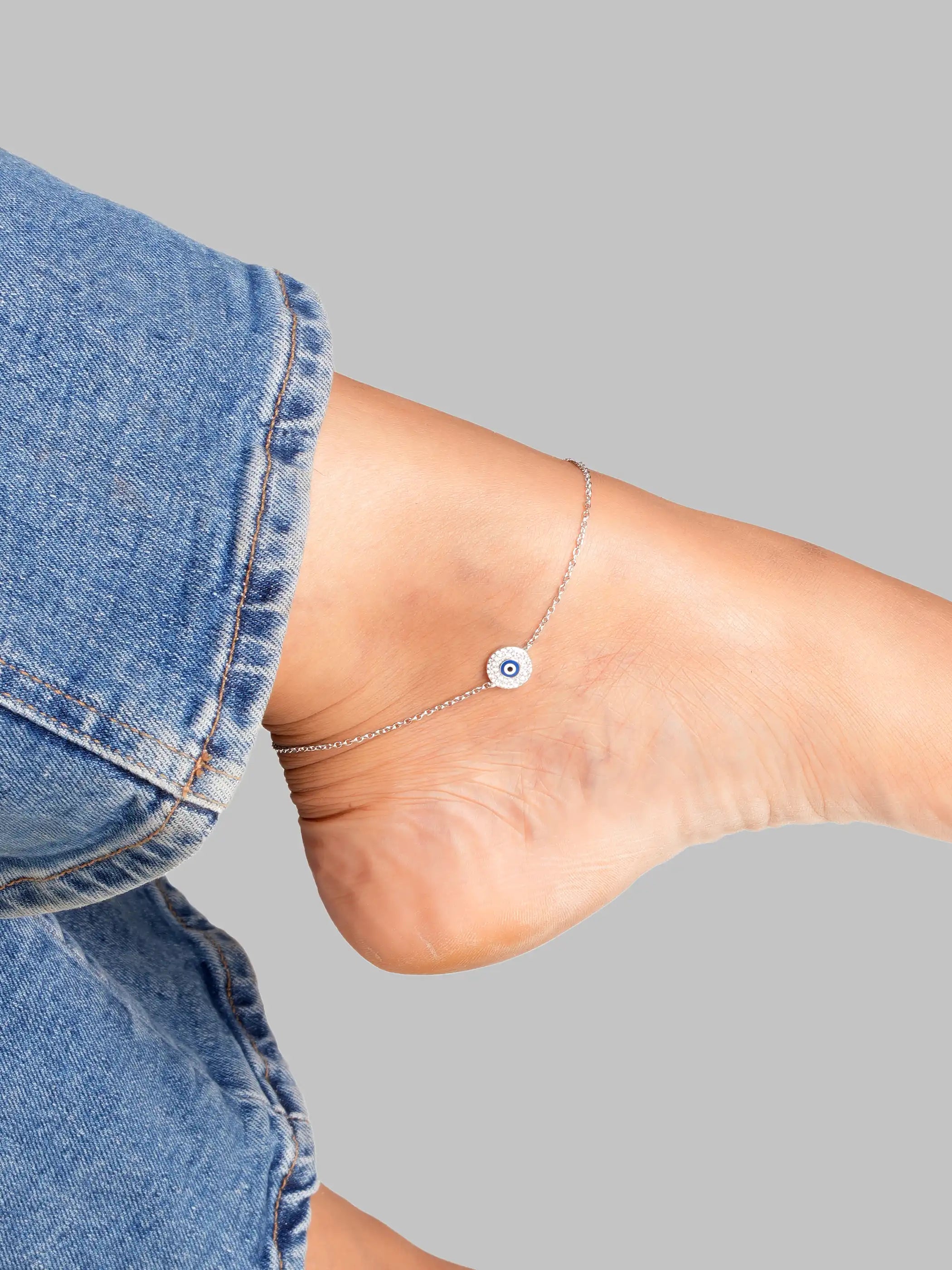 925 silver necklace with round evil eye charm, accented with blue enamel center and crystal-studded halo detailing