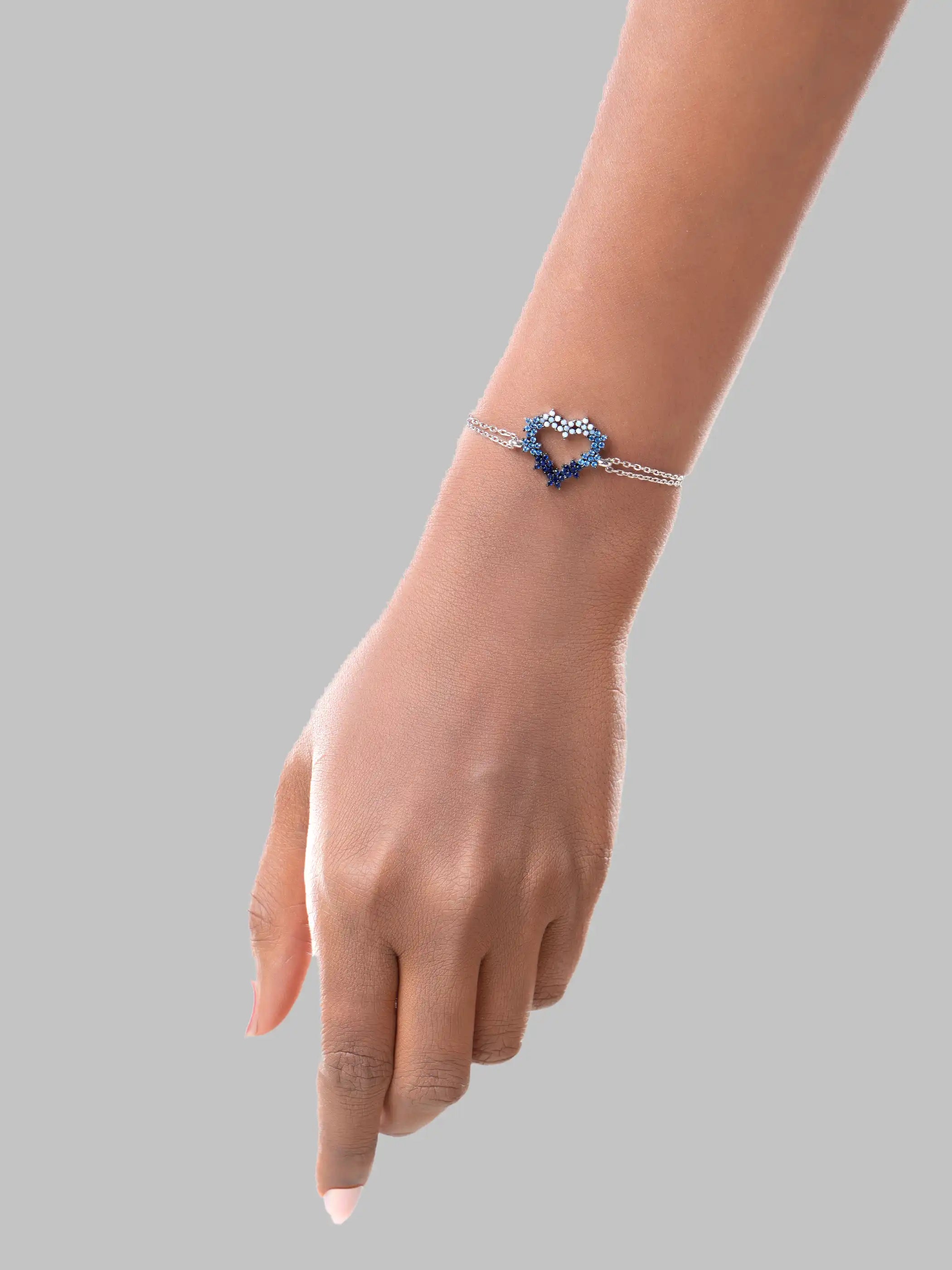 925 silver bracelet with dual chain and open heart charm embellished with white and blue stones