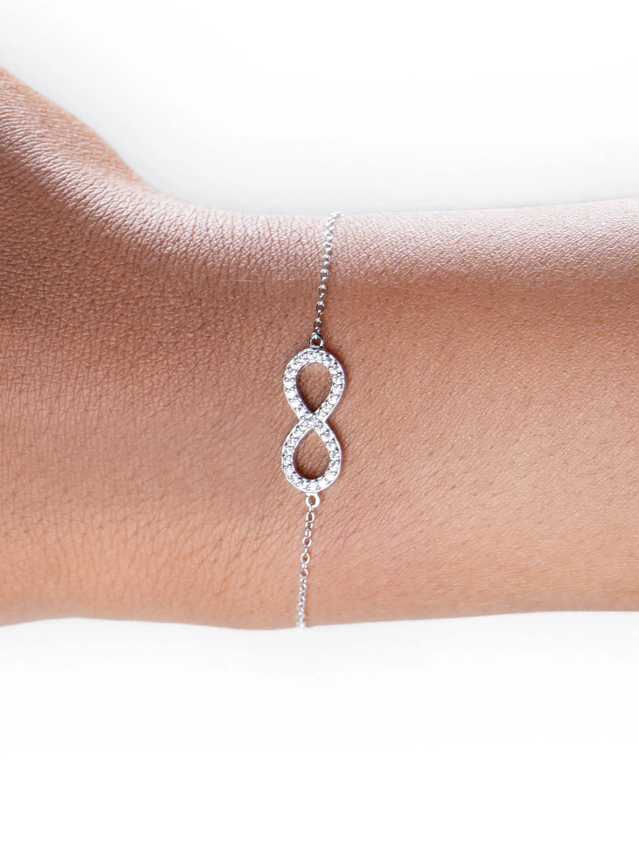 925 silver adjustable bracelet with sparkling infinity symbol charm encrusted with white stones