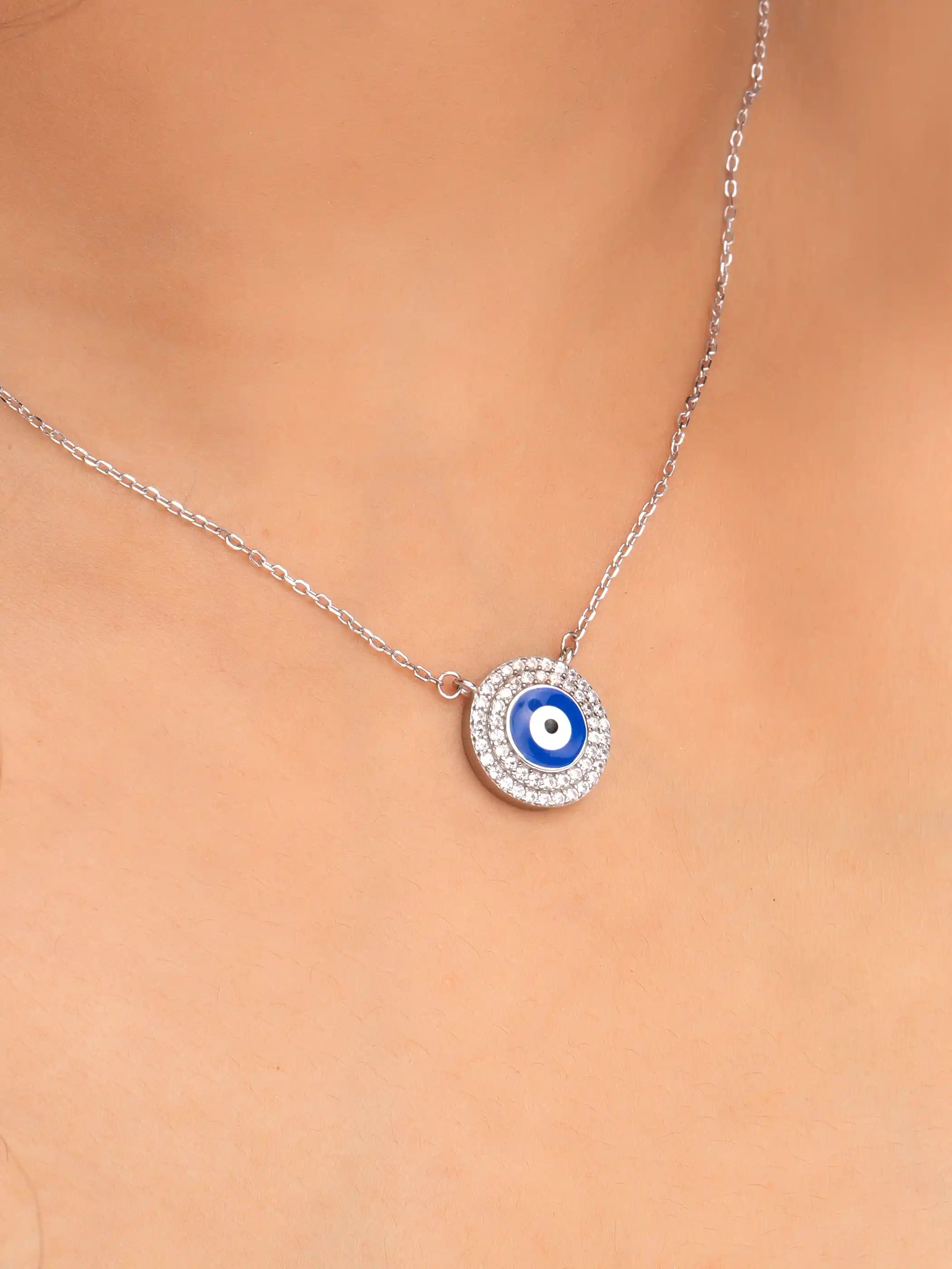 925 silver necklace with a round blue evil eye pendant surrounded by sparkling crystals on a delicate chain for everyday protection and style
