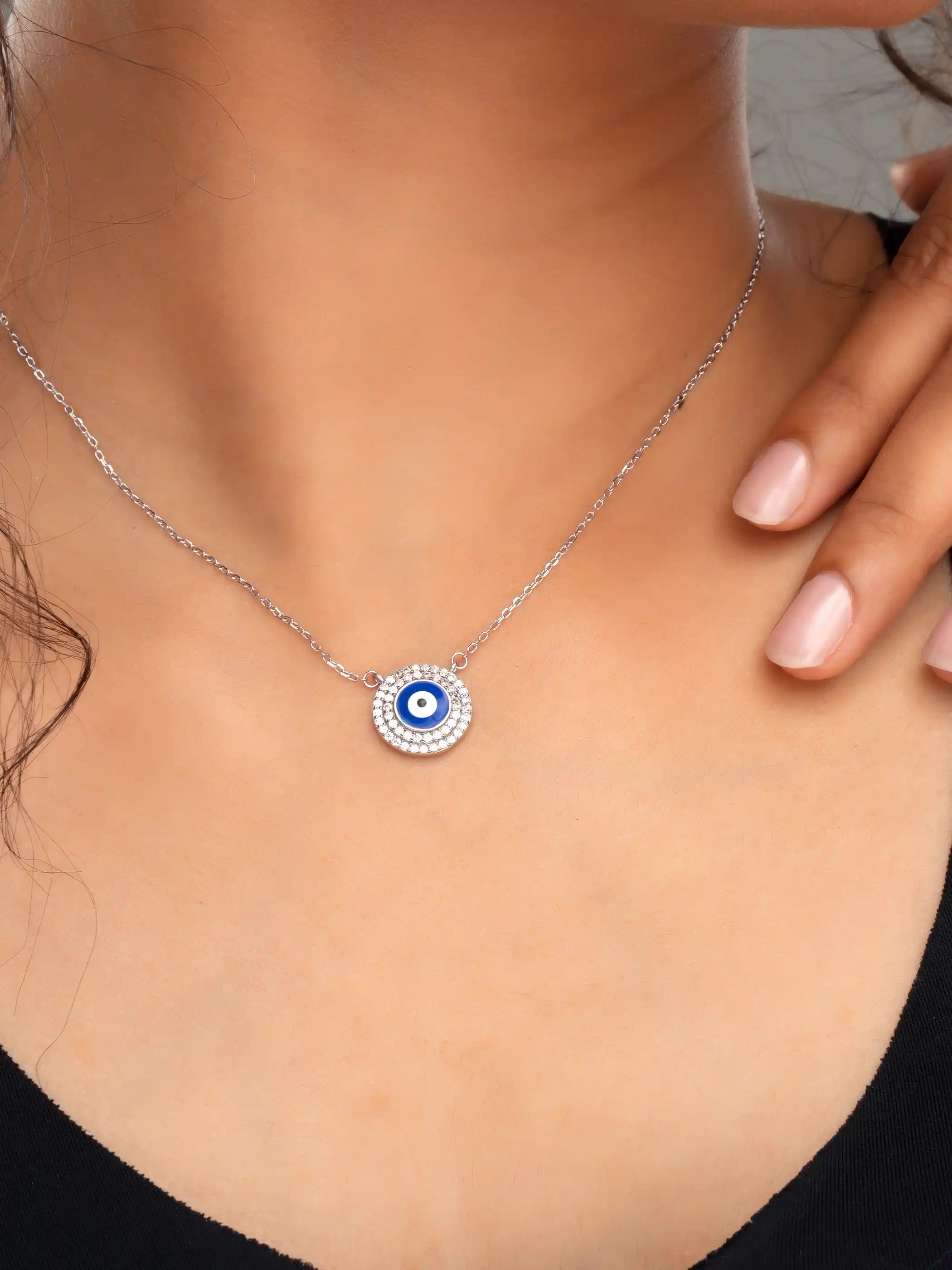 925 silver necklace with a round blue evil eye pendant surrounded by sparkling crystals on a delicate chain for everyday protection and style