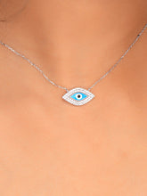 925 silver necklace with blue evil eye pendant framed in sparkling stones, symbolizing protection and modern elegance