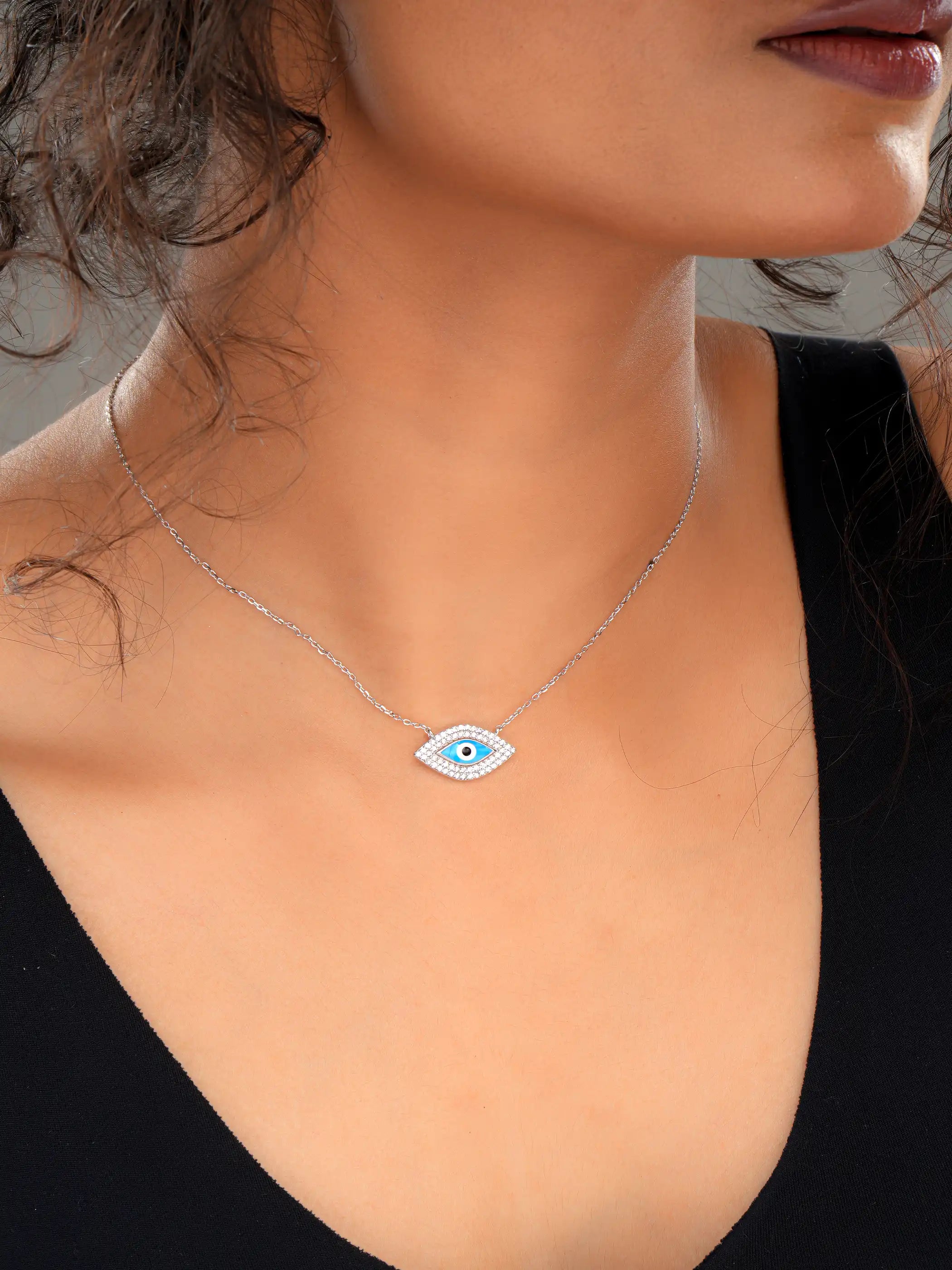 925 silver necklace with blue evil eye pendant framed in sparkling stones, symbolizing protection and modern elegance
