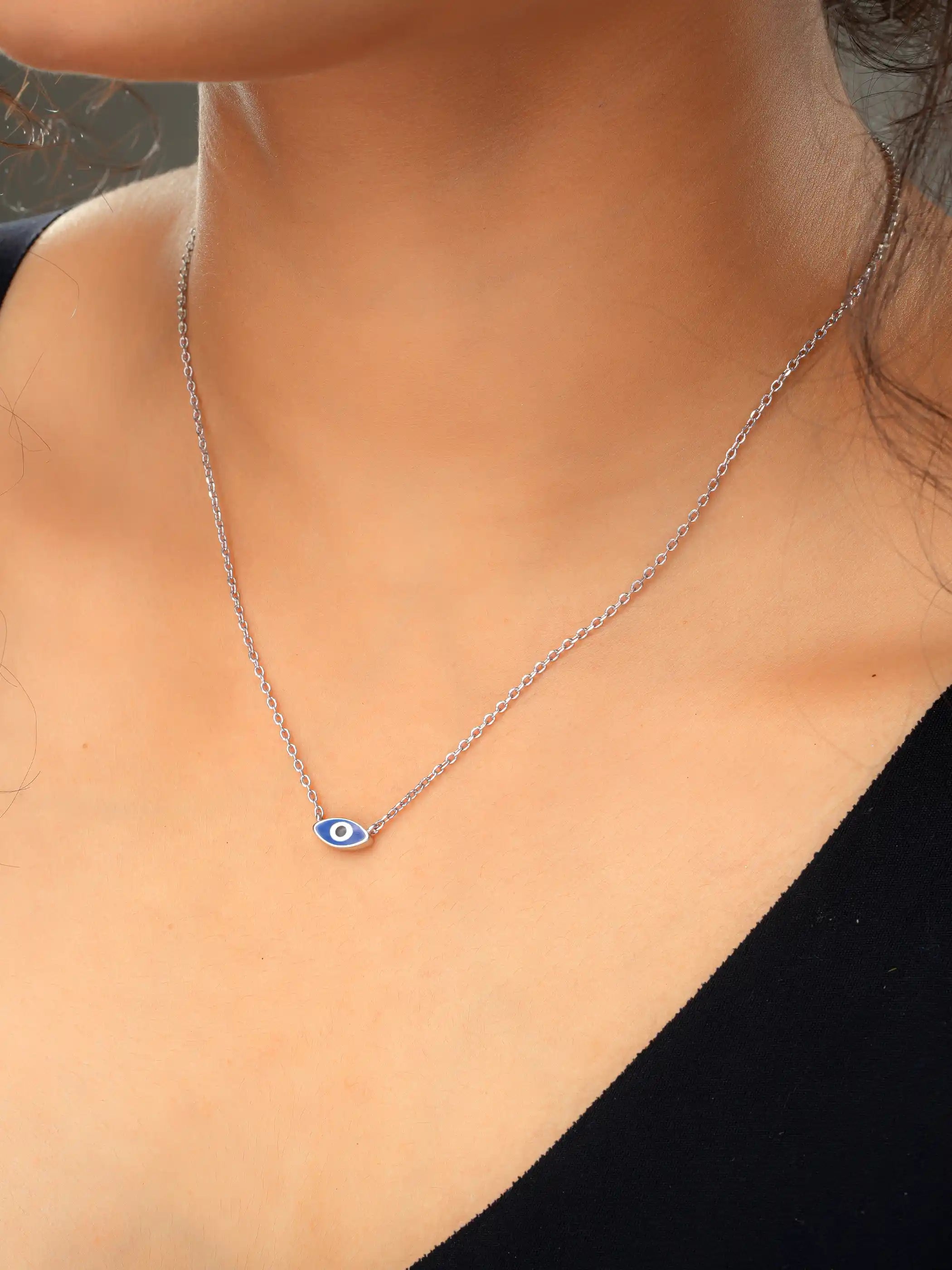 925 silver necklace with a dark blue evil eye charm on a fine chain, symbolizing protection and minimalist elegance