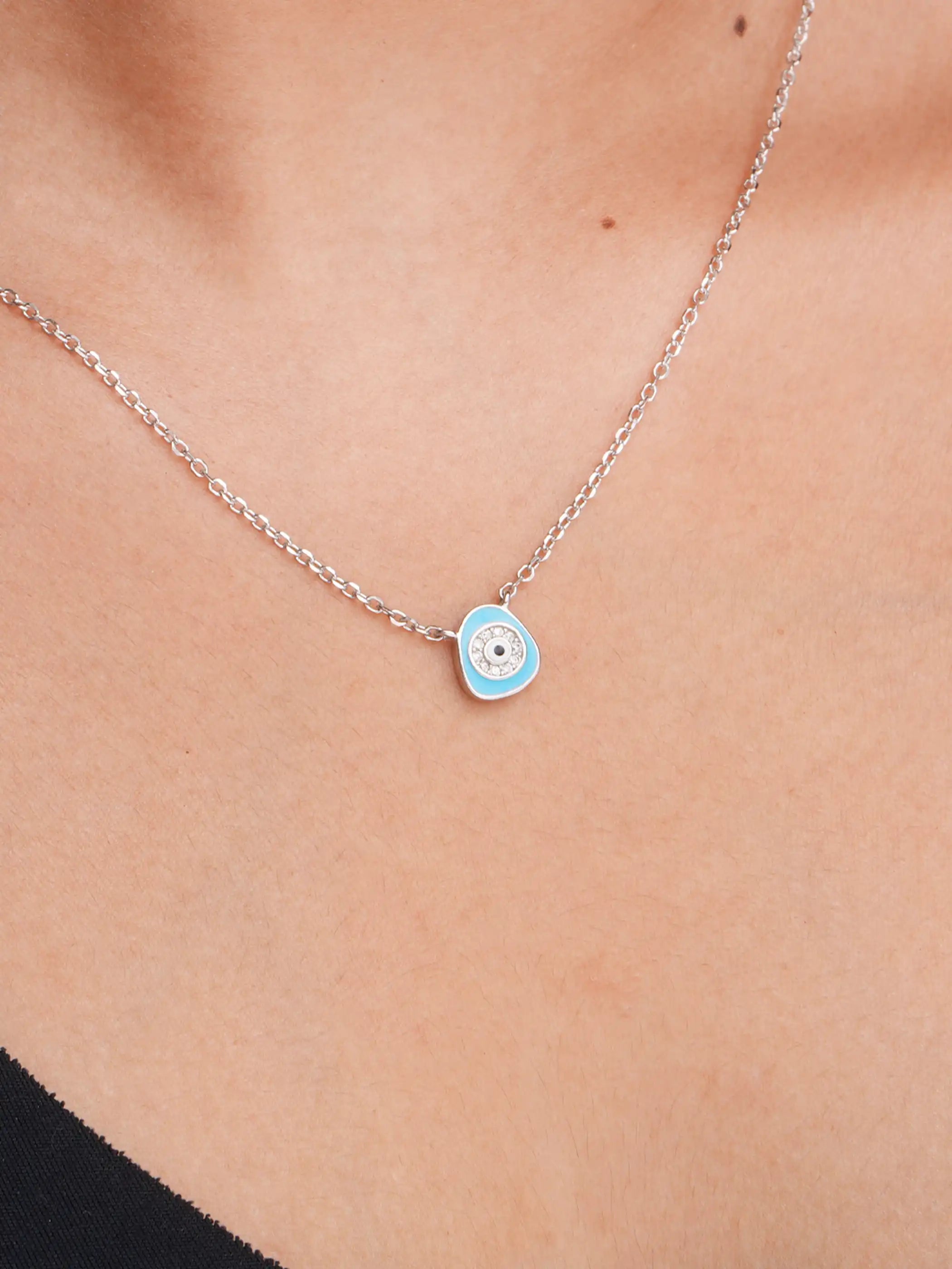 925 silver necklace with a light blue evil eye pendant surrounded by crystal detailing on a delicate chain for everyday protection and style