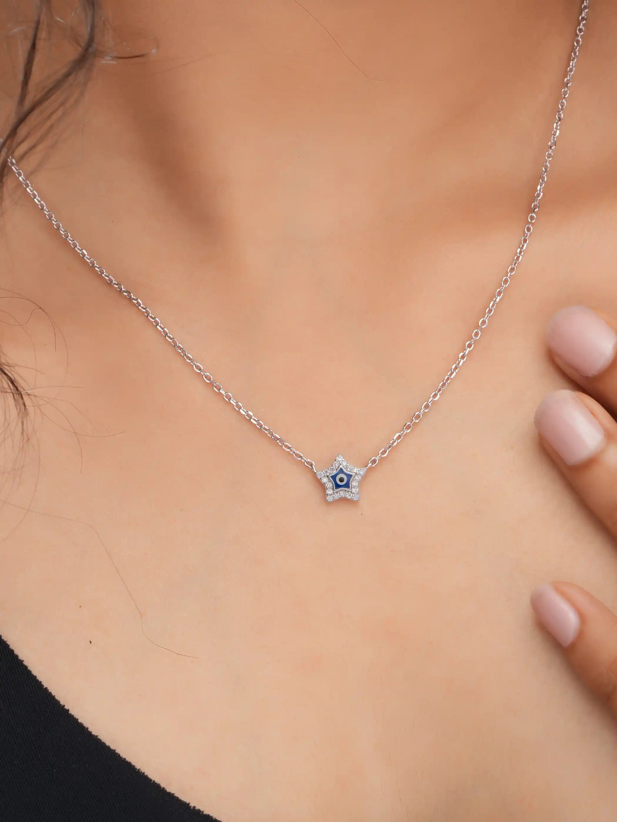 925 silver star-shaped evil eye necklace with crystal detailing on a delicate chain for charm and protection