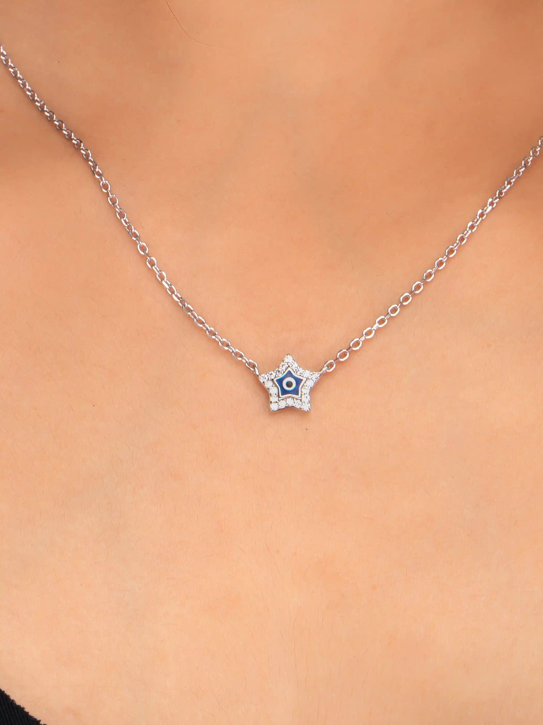 925 silver star-shaped evil eye necklace with crystal detailing on a delicate chain for charm and protection