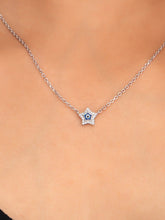 925 silver star-shaped evil eye necklace with crystal detailing on a delicate chain for charm and protection