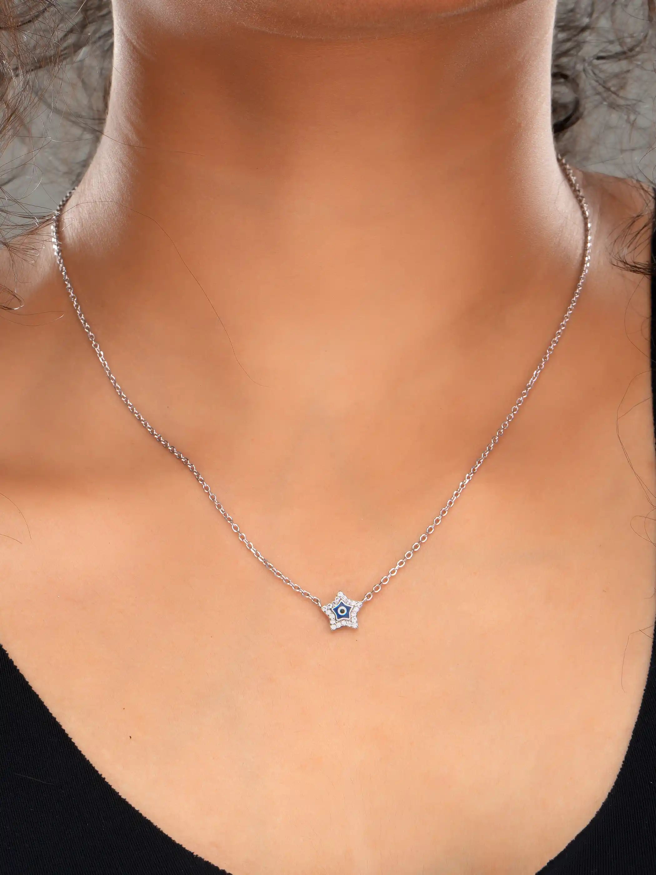 925 silver star-shaped evil eye necklace with crystal detailing on a delicate chain for charm and protection