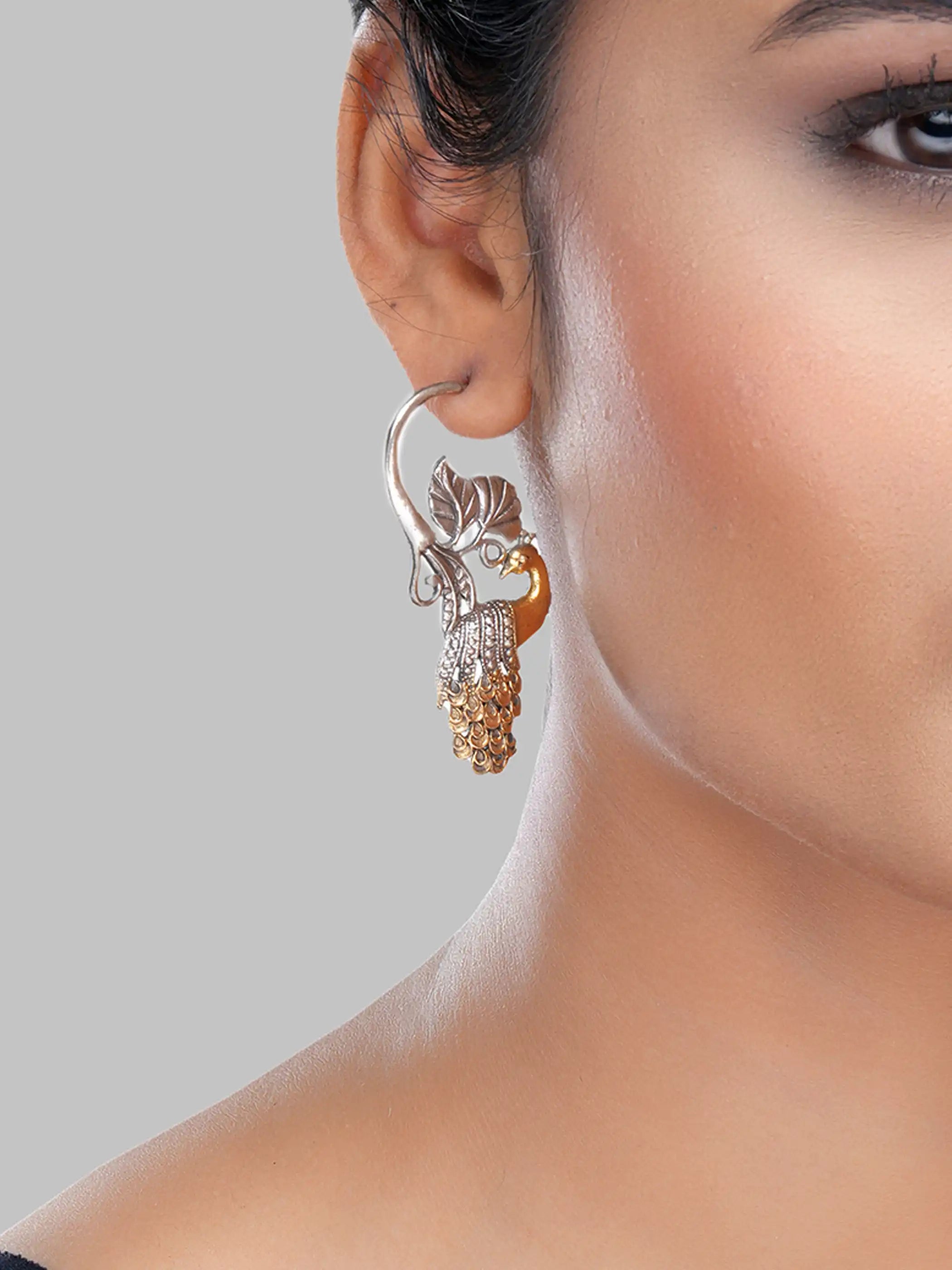 925 silver dual-tone peacock motif earrings with gold-plated feathers and oxidized leaf detailing