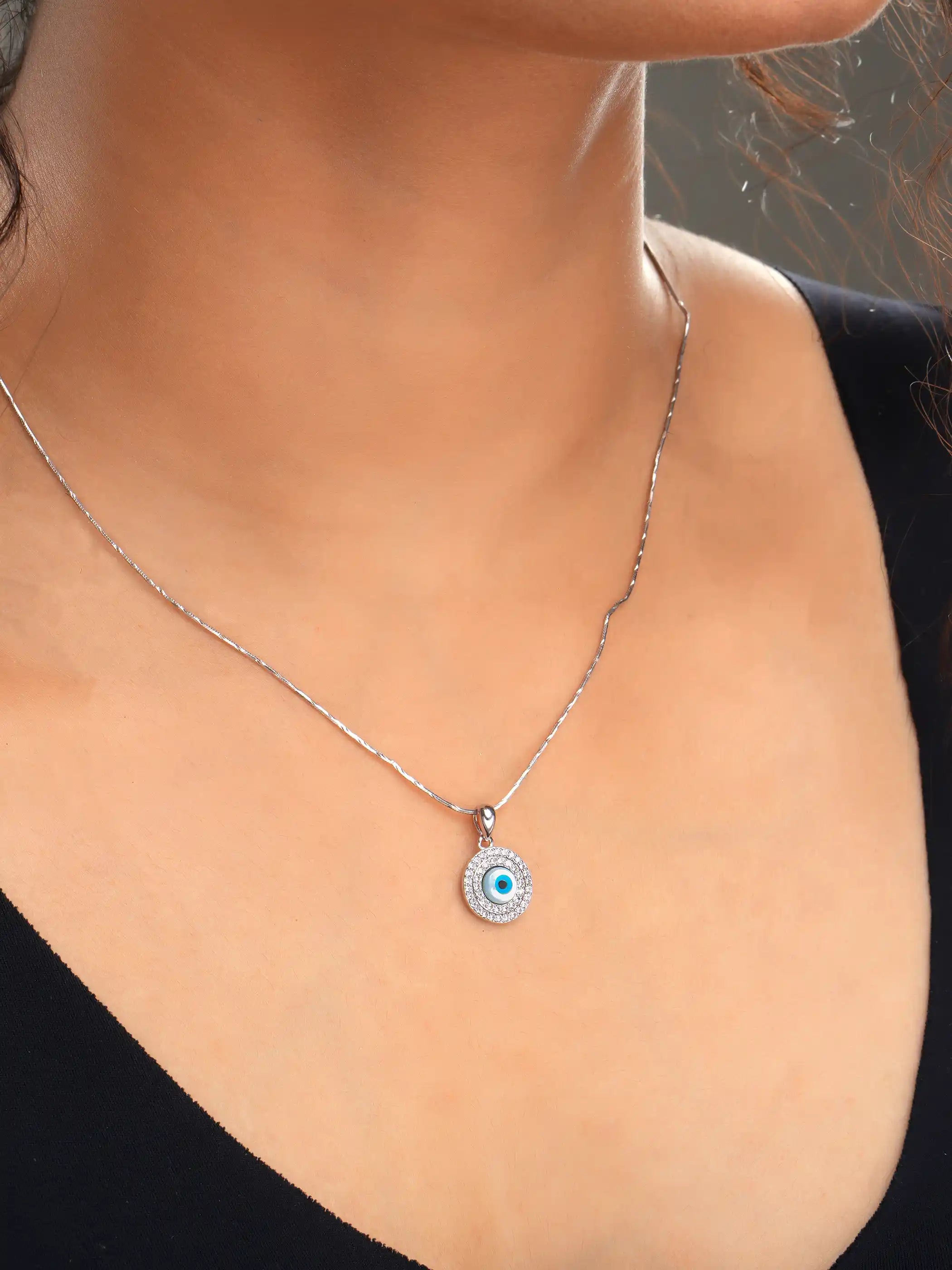 925 silver round pendant with blue evil eye center and crystal-studded halo for a bold protective charm