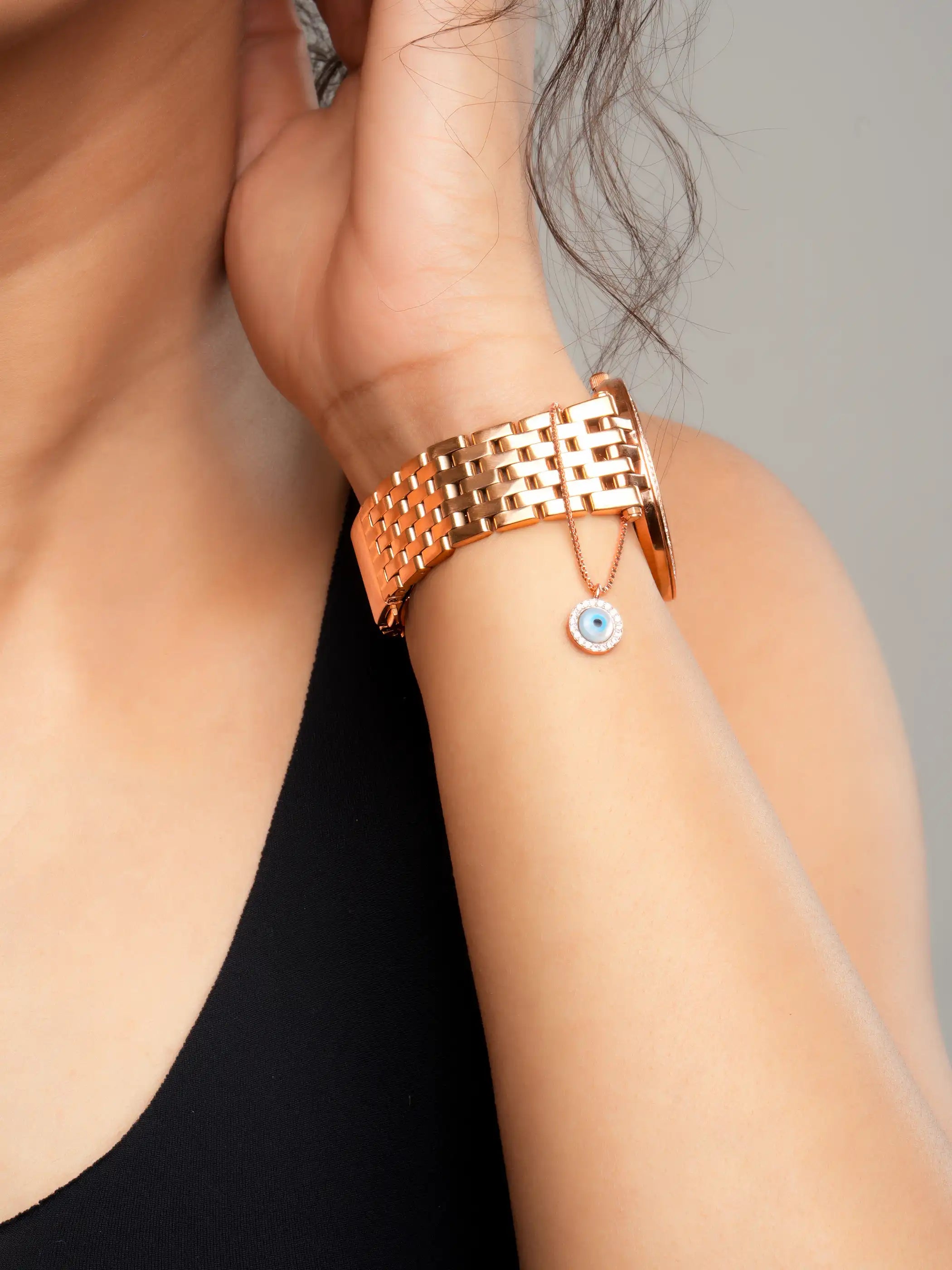 925 silver rose gold plated necklace with round blue evil eye pendant surrounded by sparkling crystals for a chic protective charm