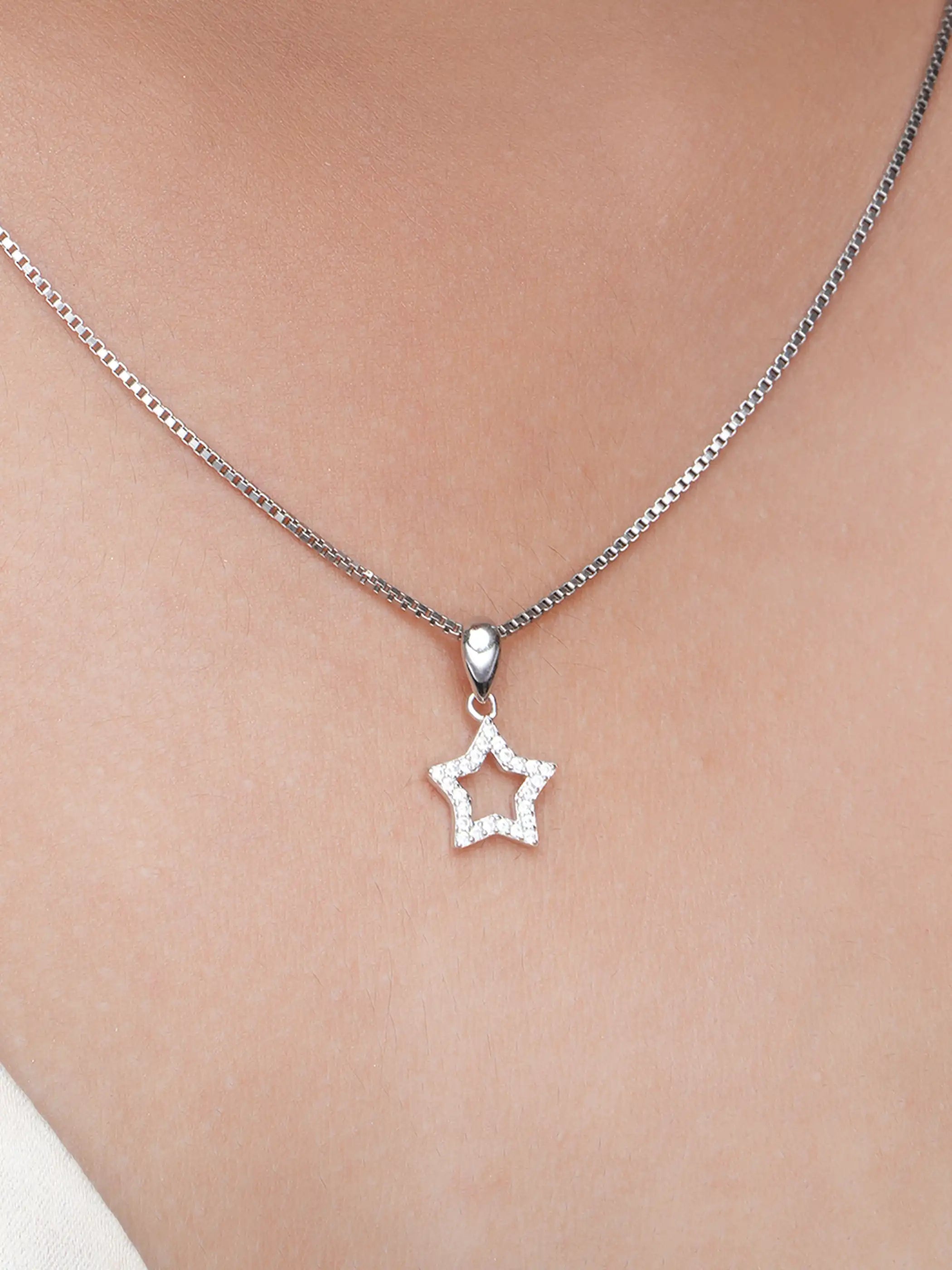 925 silver star-shaped pendant with crystal-studded open design and polished bail detailing