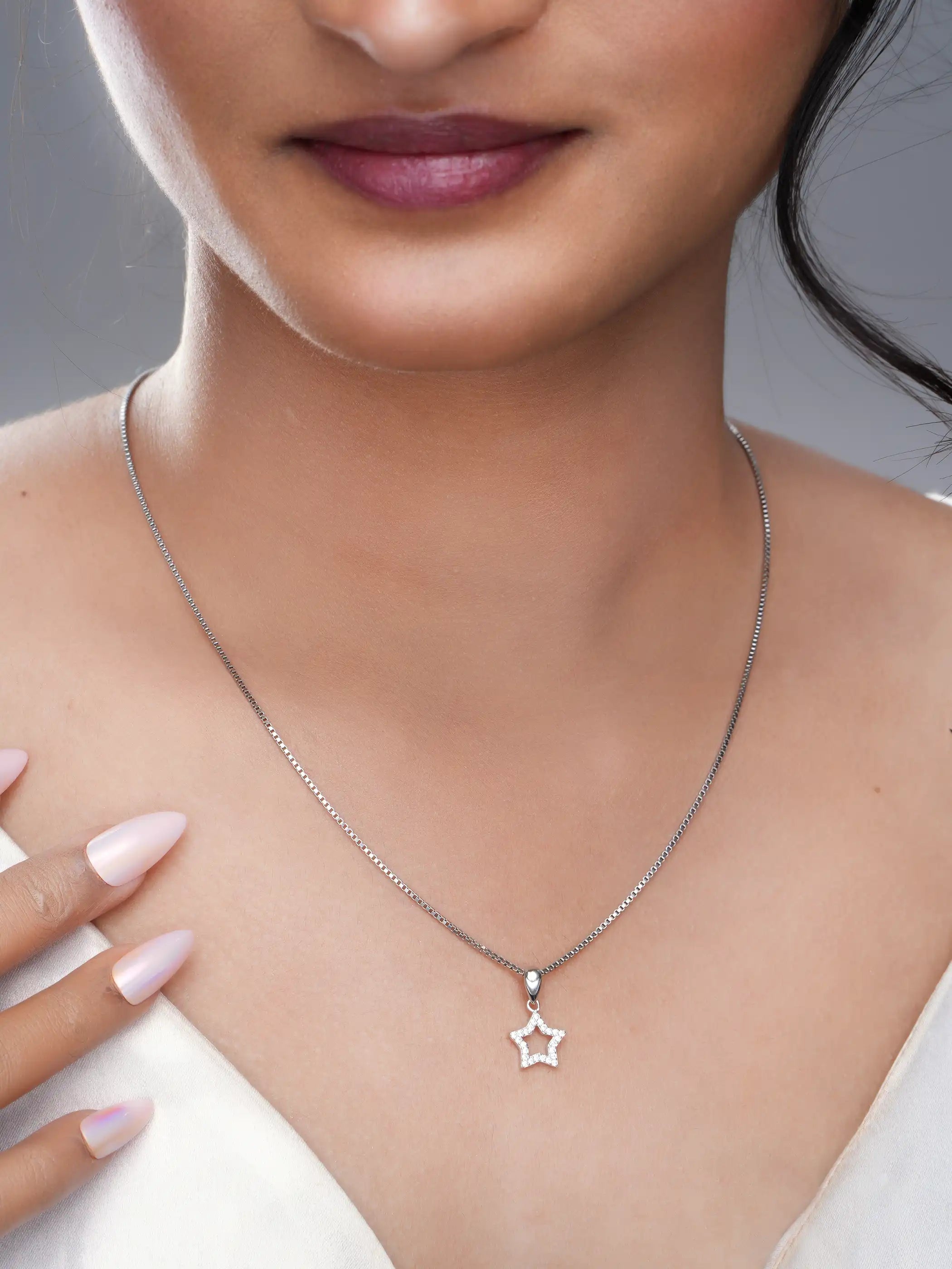 925 silver star-shaped pendant with crystal-studded open design and polished bail detailing
