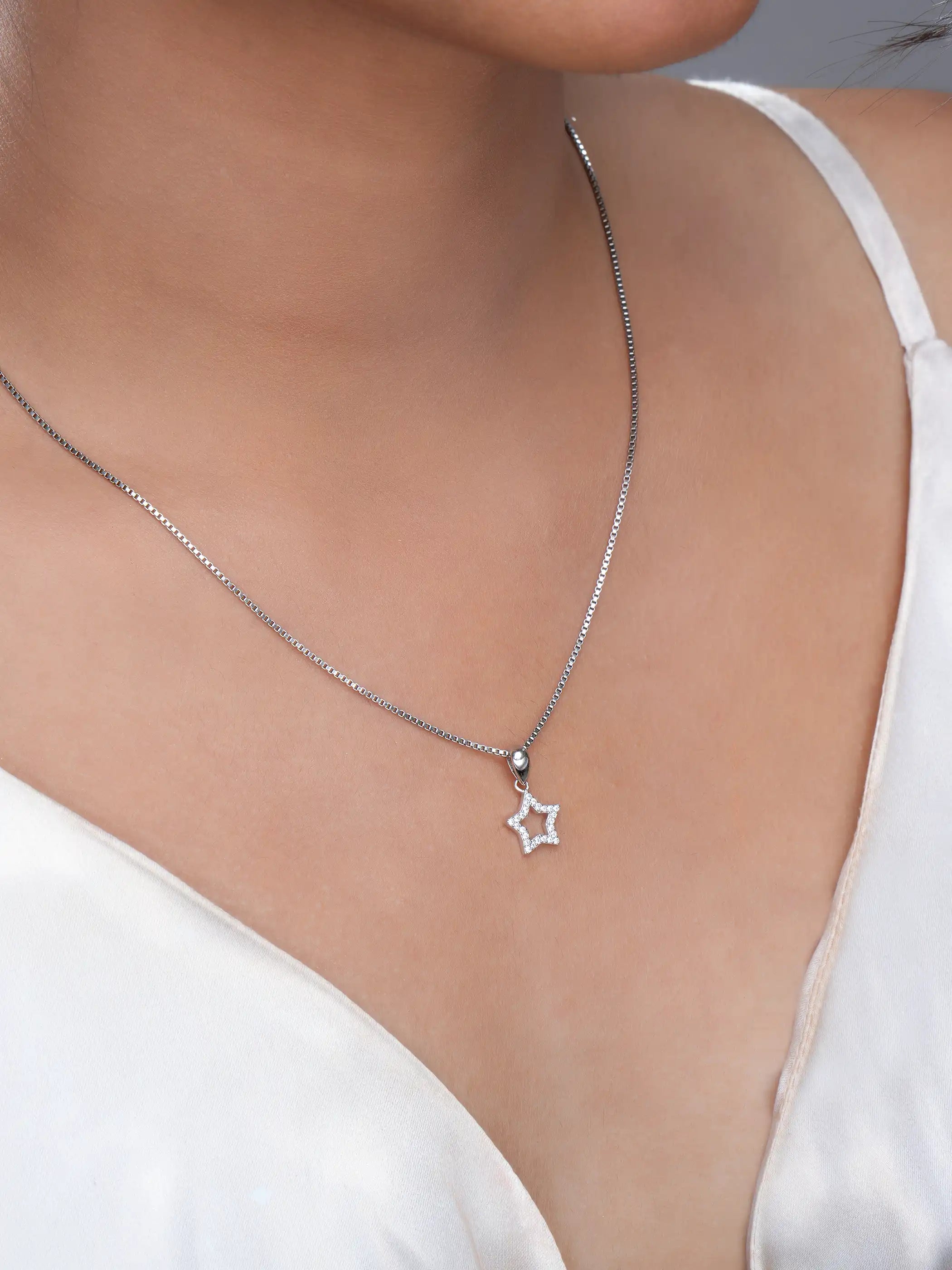 925 silver star-shaped pendant with crystal-studded open design and polished bail detailing