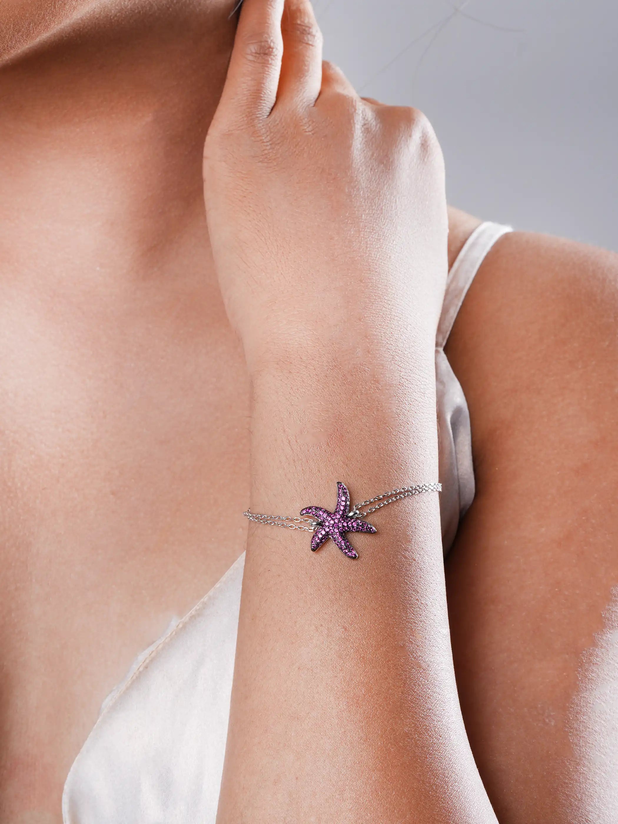 925 silver bracelet with pink stone-studded starfish charm and dual chain design