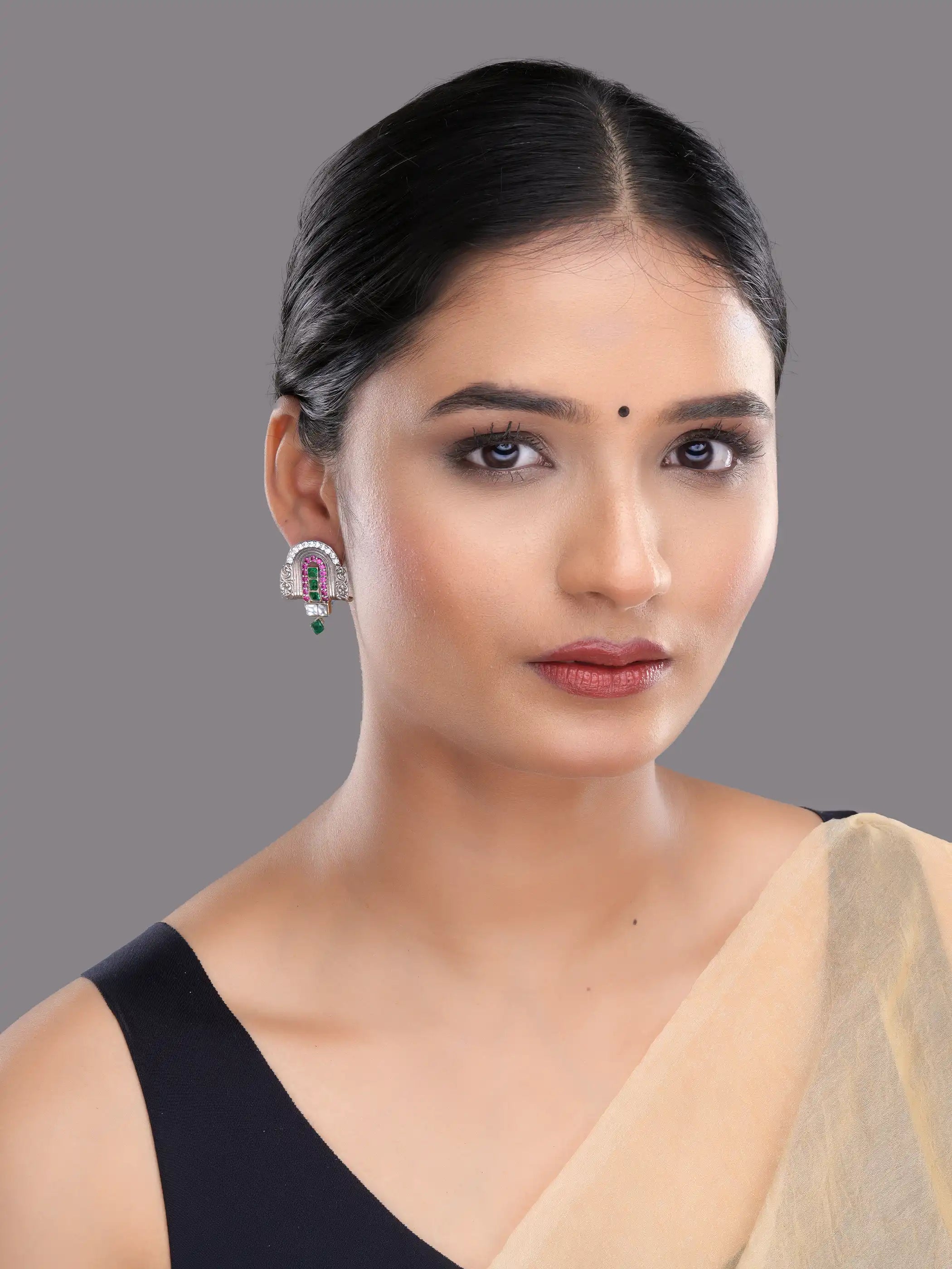 925 silver temple-inspired earrings with green emerald, ruby pink, and white stones in intricate design