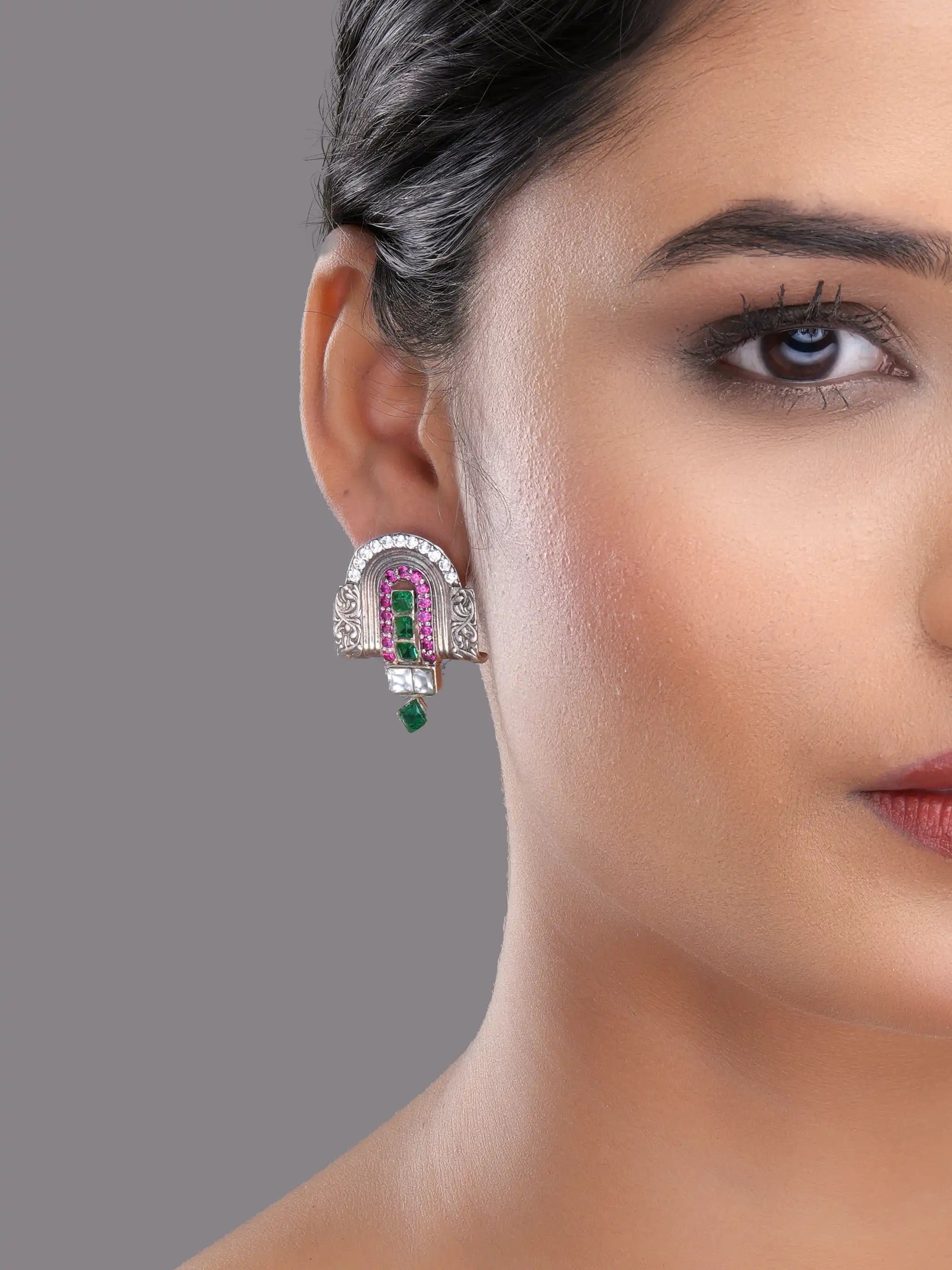 925 silver temple-inspired earrings with green emerald, ruby pink, and white stones in intricate design
