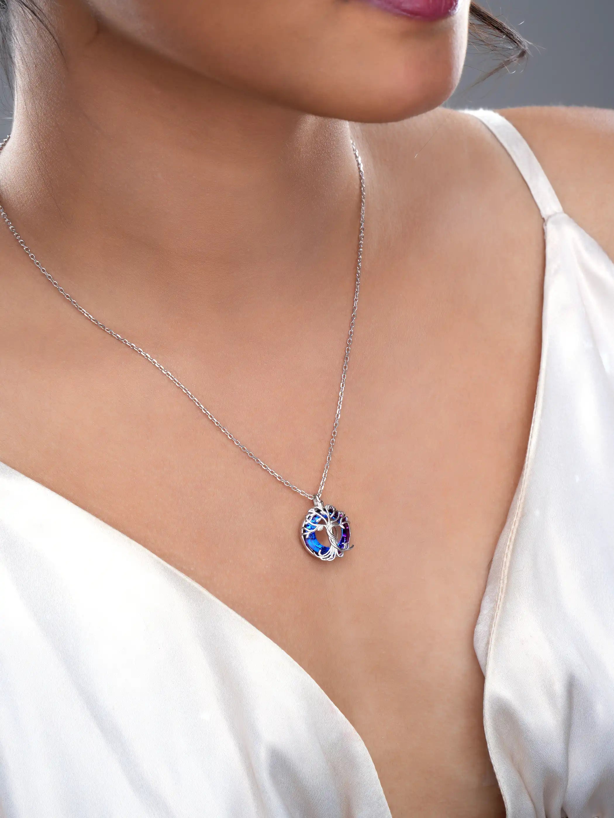 925 silver pendant necklace with tree of life design and round purple-blue crystal background on fine chain
