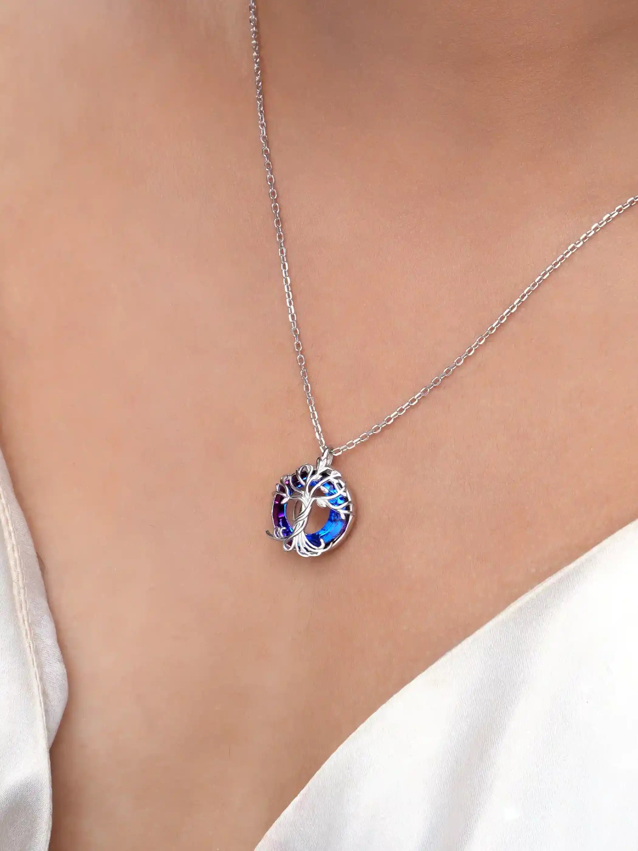 925 silver pendant necklace with tree of life design and round purple-blue crystal background on fine chain