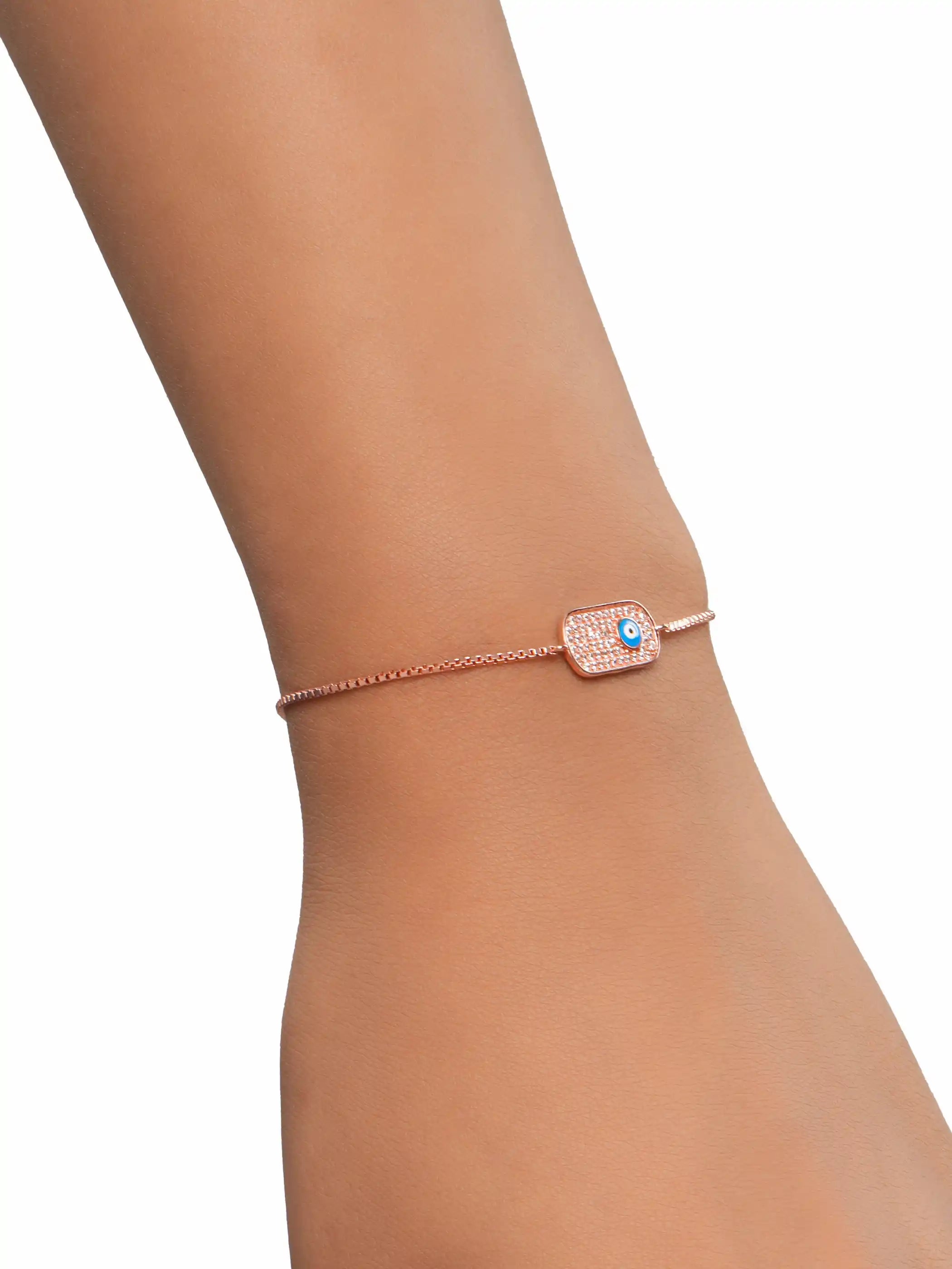 Rose gold plated 925 silver adjustable bracelet with rectangular cubic zirconia plate and blue evil eye charm