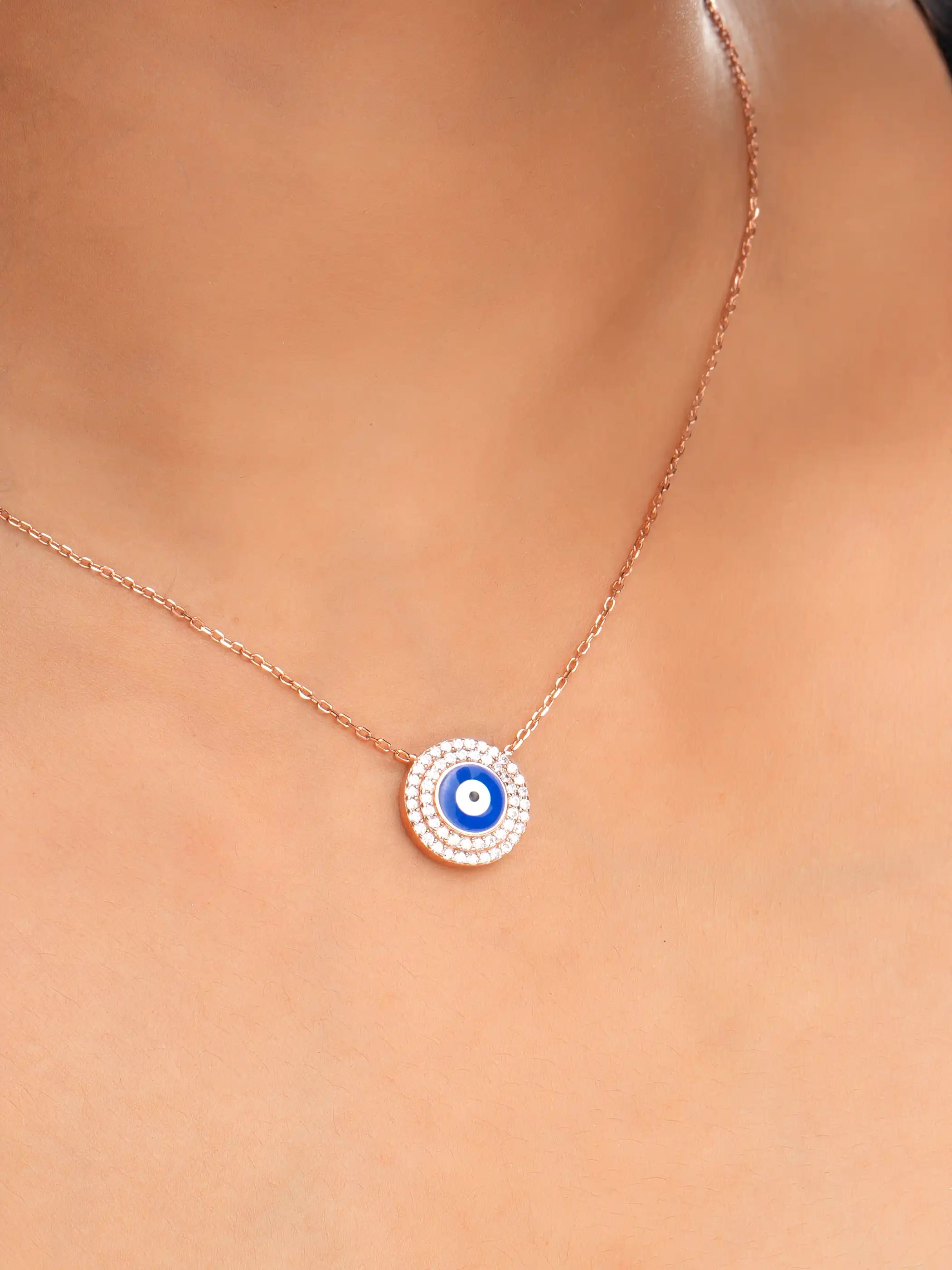 925 silver rose gold plated necklace with round blue evil eye pendant surrounded by sparkling crystals for chic everyday protection