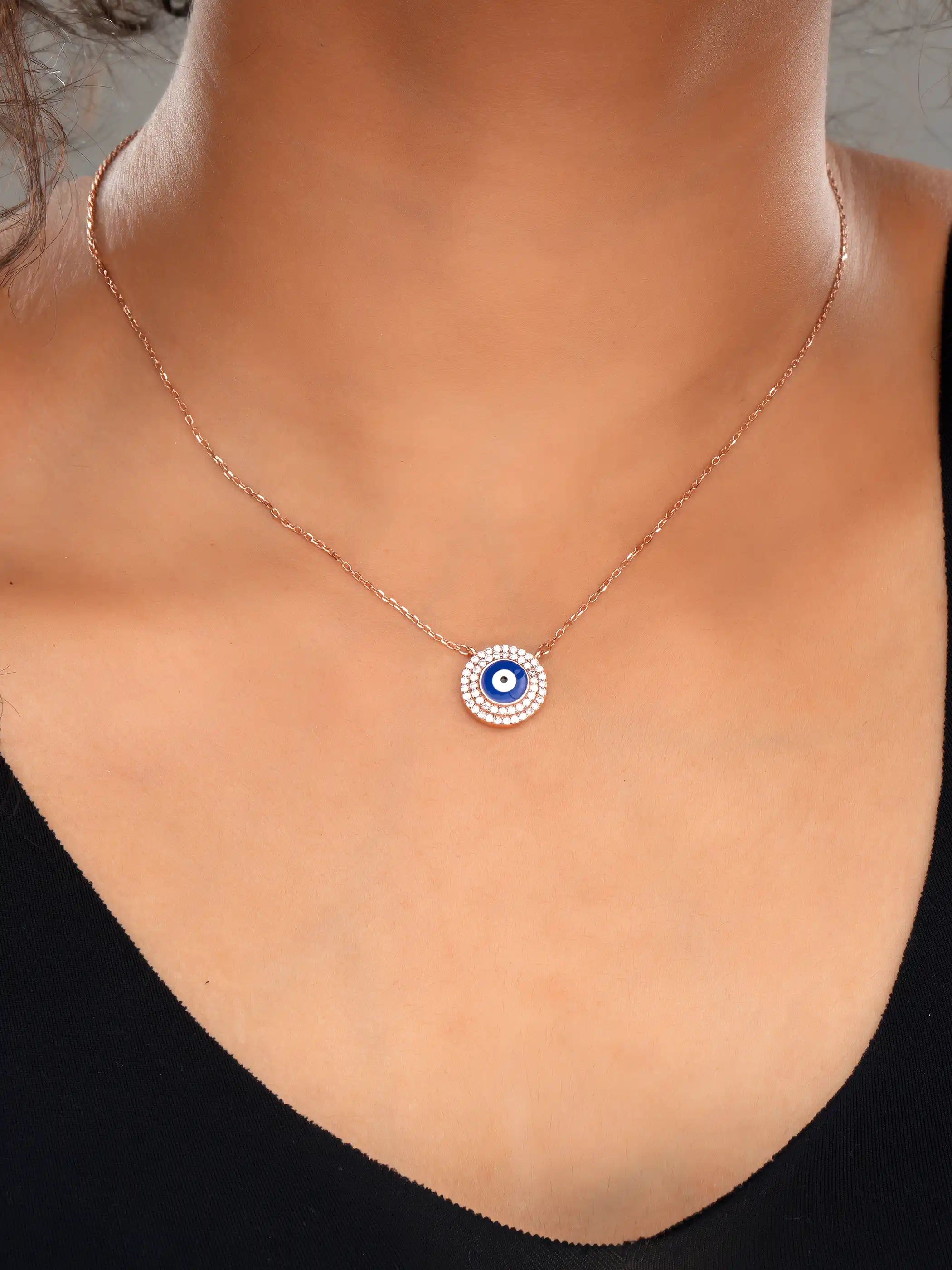 925 silver rose gold plated necklace with round blue evil eye pendant surrounded by sparkling crystals for chic everyday protection