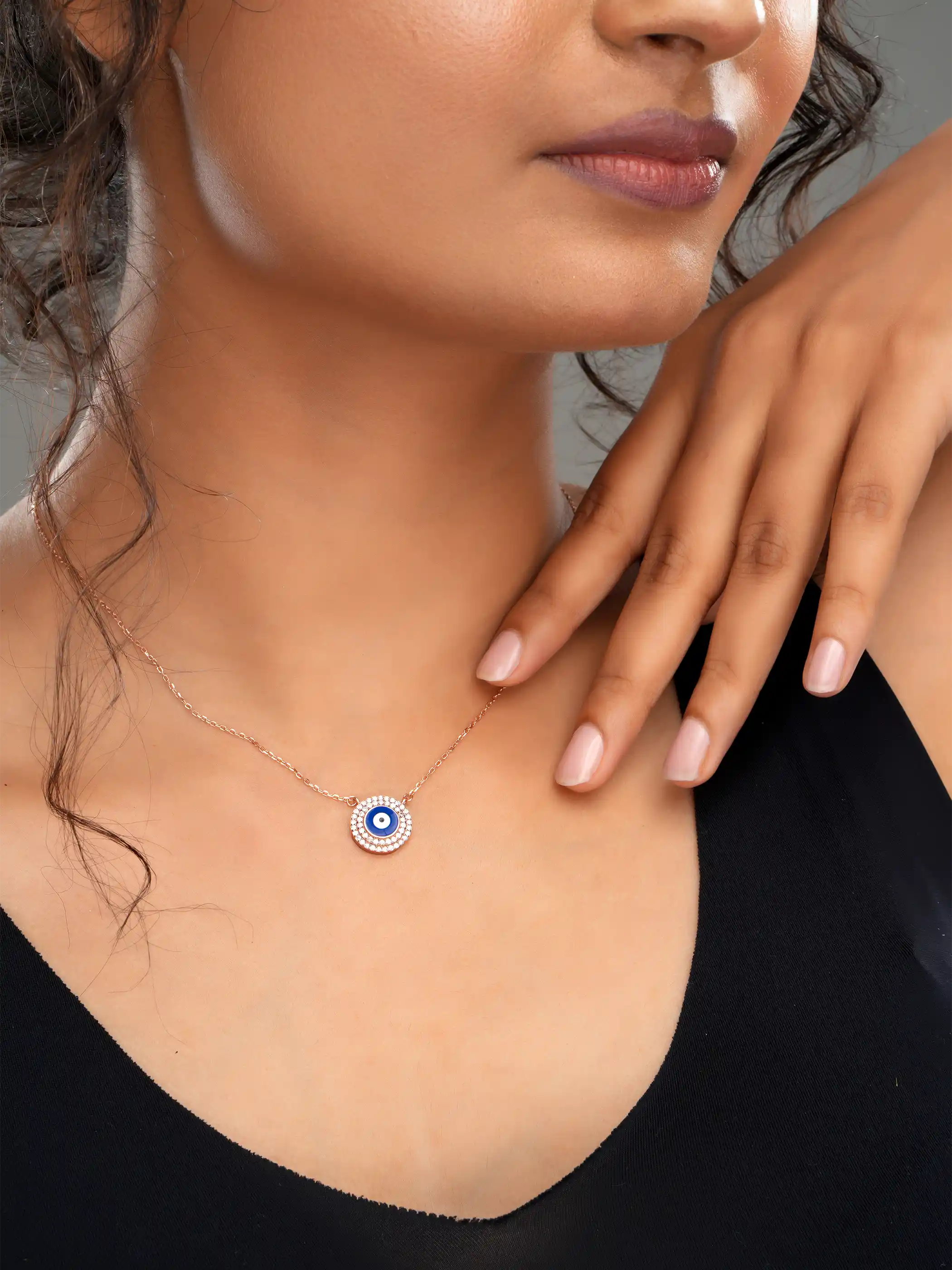 925 silver rose gold plated necklace with round blue evil eye pendant surrounded by sparkling crystals for chic everyday protection