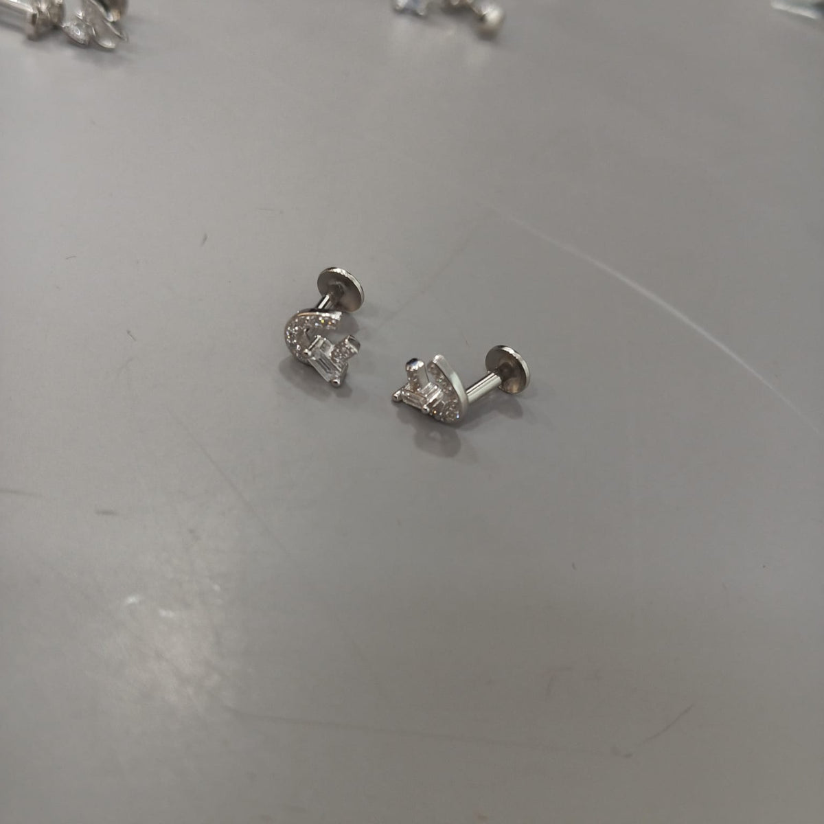 925 sterling silver stud earrings with clear-stone horseshoe outlines and rectangular accents, side view.