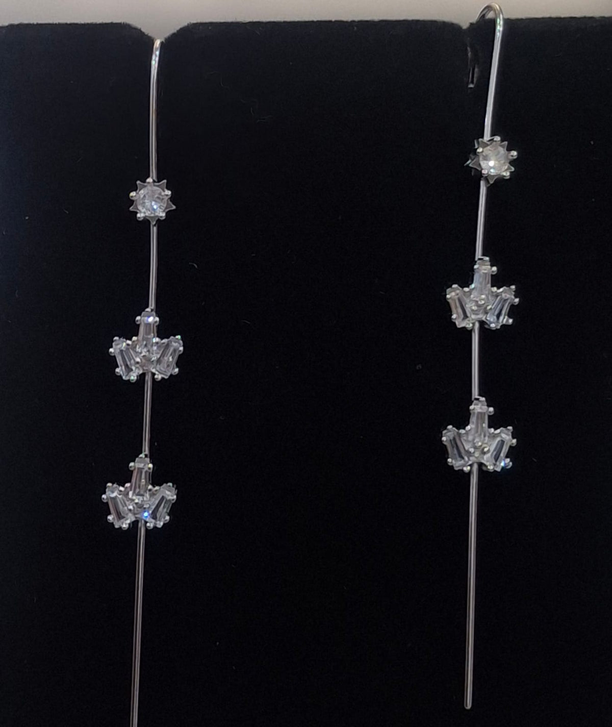 925 sterling silver ear needle pin with round centre and geometric fan clusters, shown from front and side.