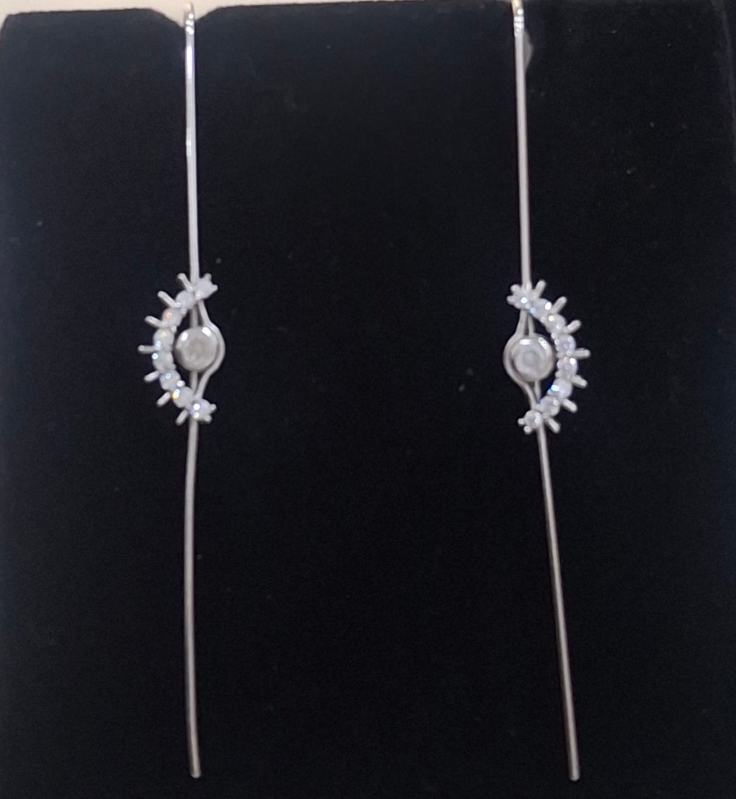 925 sterling silver ear needle pin with celestial eye and curved stone accents, shown from front and side.