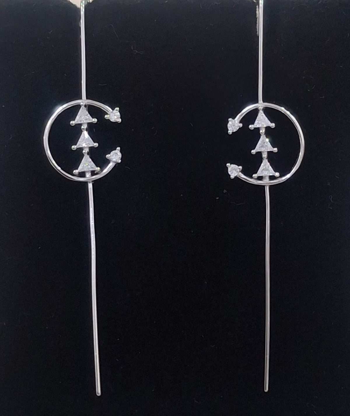 925 sterling silver ear needle pin with crescent orbit and triangular stones, shown from front and side.