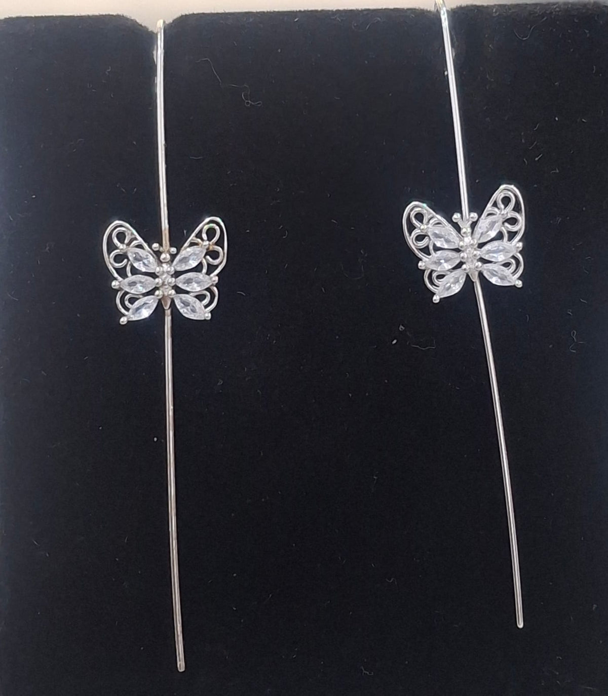 925 sterling silver ear needle pin with openwork butterfly and clear stones, shown from front and side.