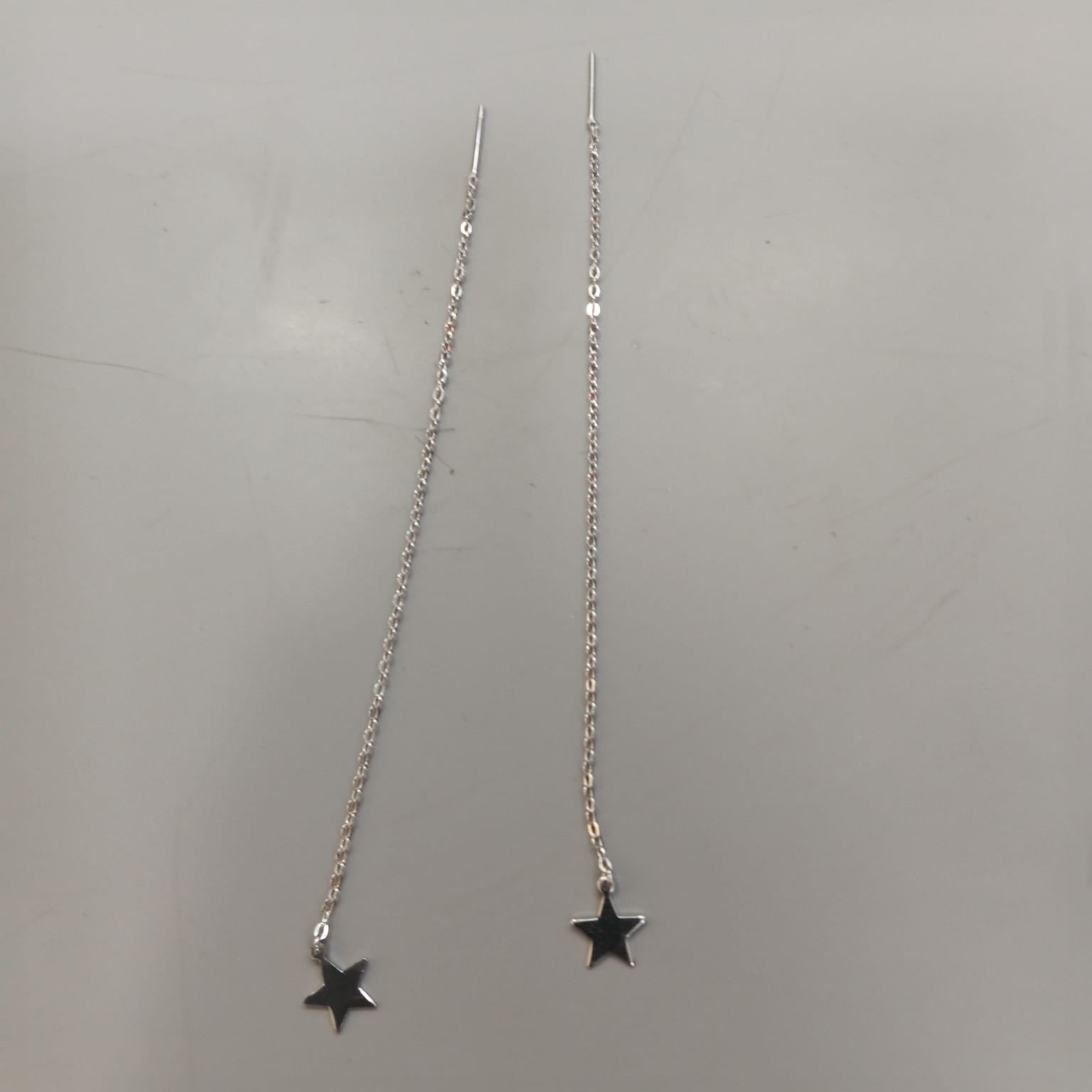 925 sterling silver Sui Dhaga earring with polished five-point star, shown from front and side.