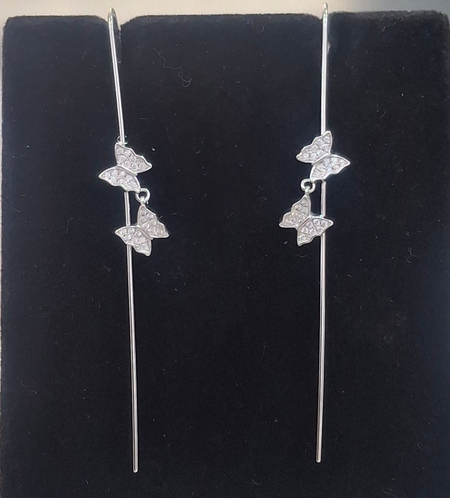 925 sterling silver ear needle pin with twin clear-stone butterflies, shown from front and side.