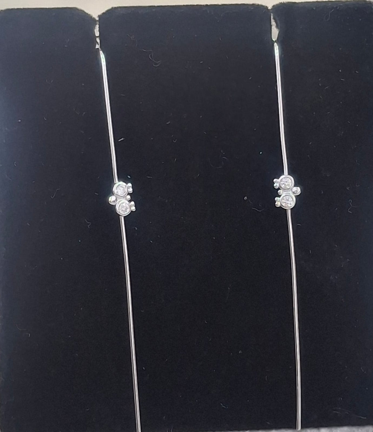 925 sterling silver ear needle pin with double round halo and bead clusters, shown from front and side.