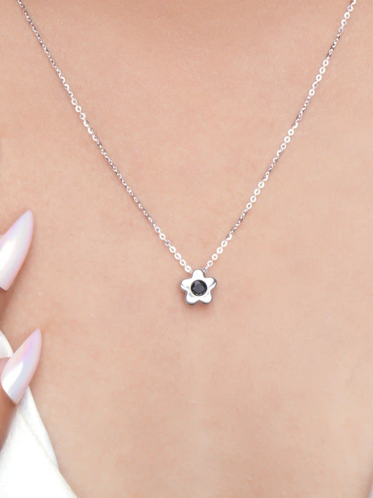 925 silver flower pendant necklace with black stone centerpiece on a fine chain