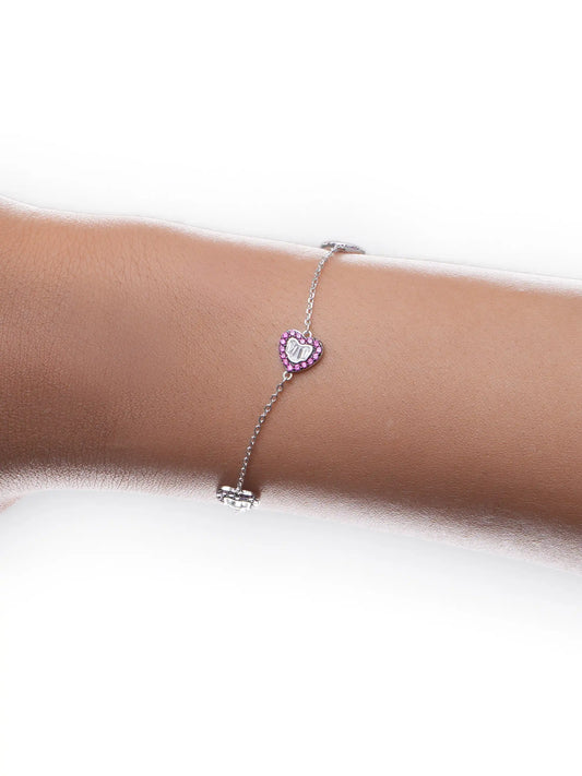925 silver bracelet with three pink crystal-studded heart charms featuring silver detailing on delicate chain