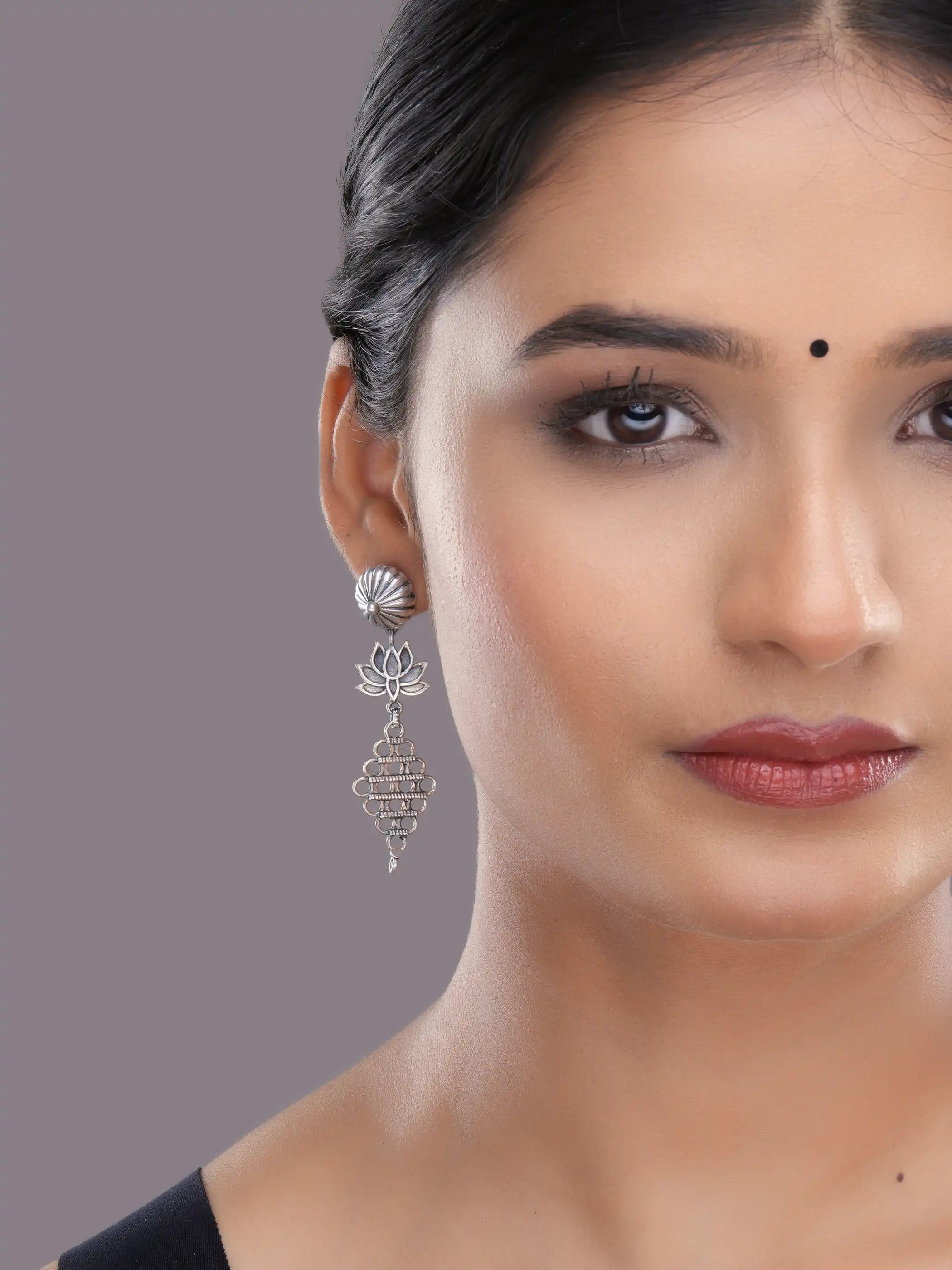 925 silver lotus motif drop earrings with oxidized detailing and intricate geometric danglers