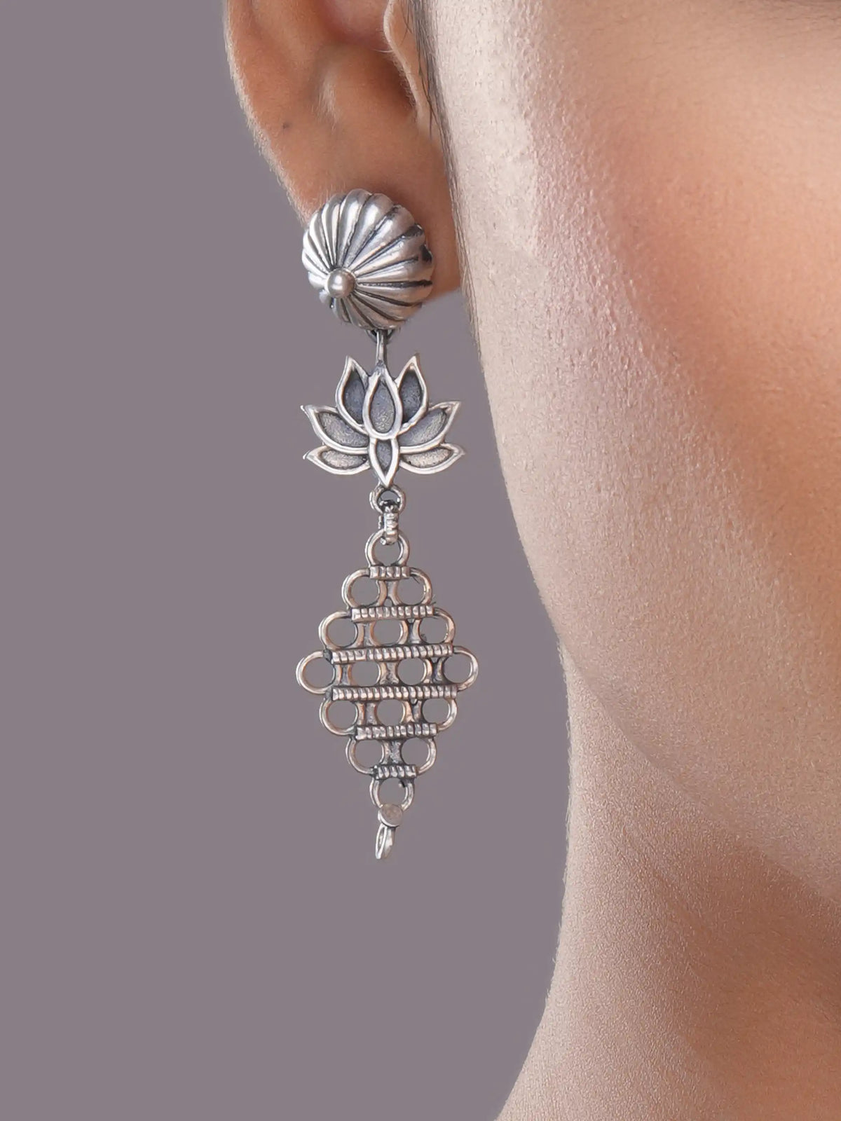 925 silver lotus motif drop earrings with oxidized detailing and intricate geometric danglers