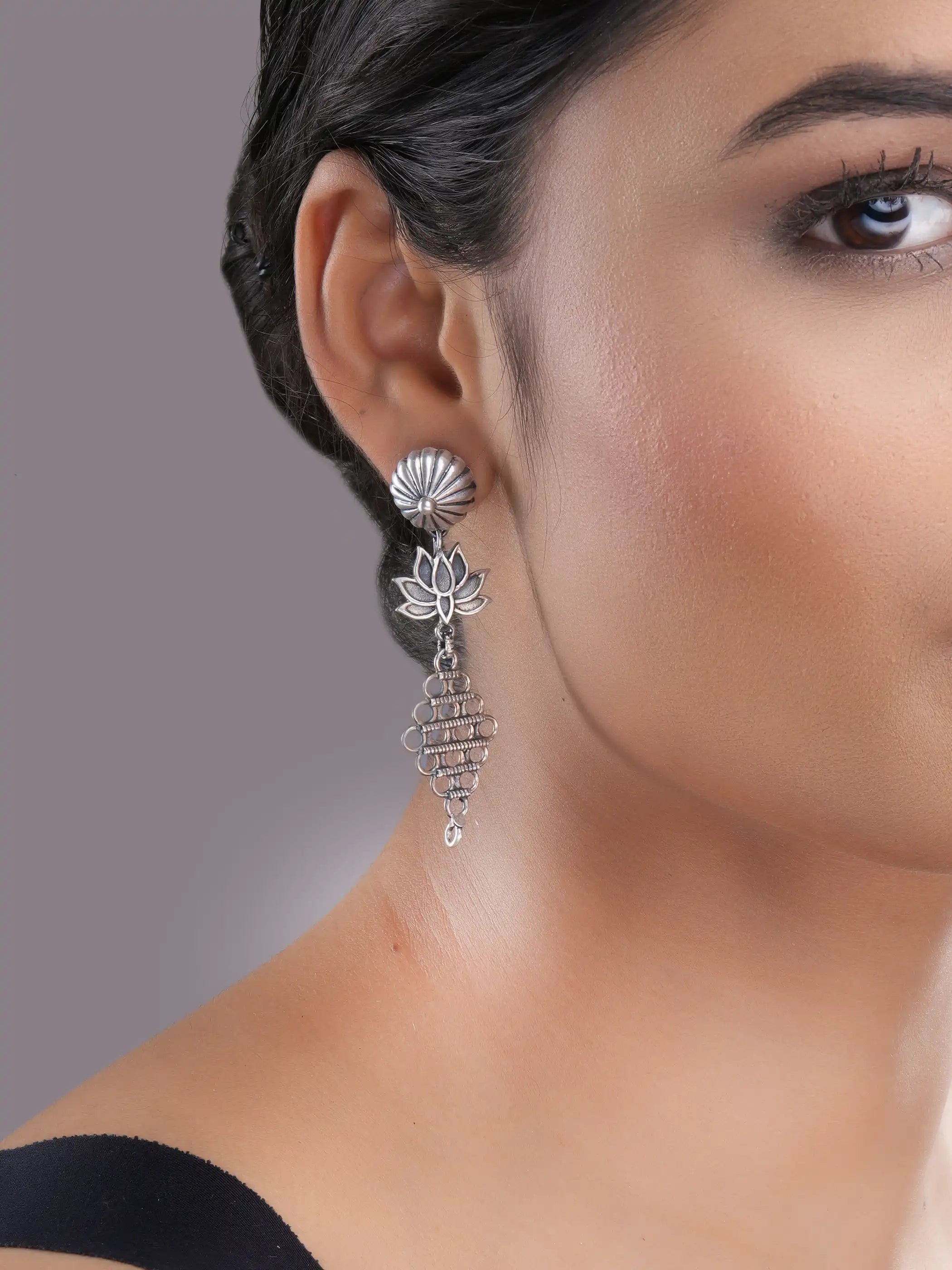 925 silver lotus motif drop earrings with oxidized detailing and intricate geometric danglers