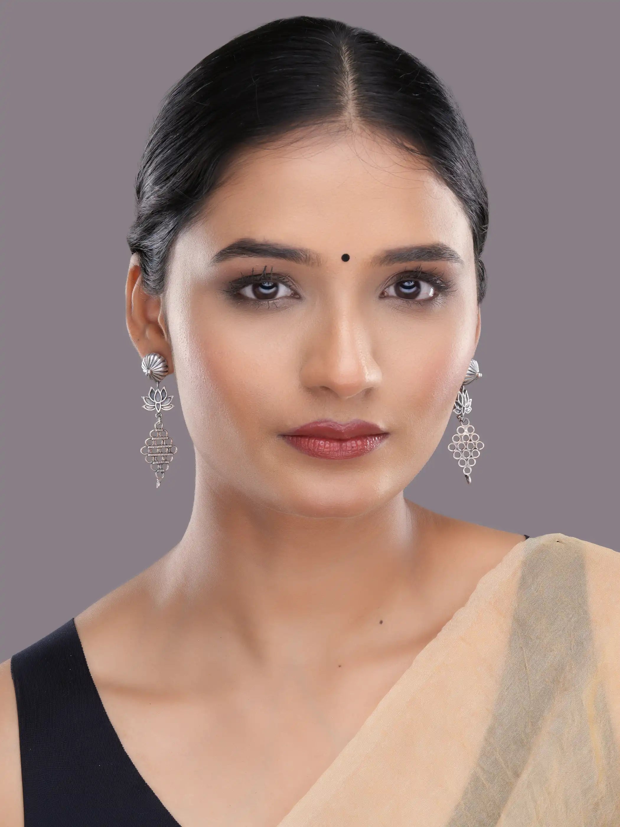 925 silver lotus motif drop earrings with oxidized detailing and intricate geometric danglers