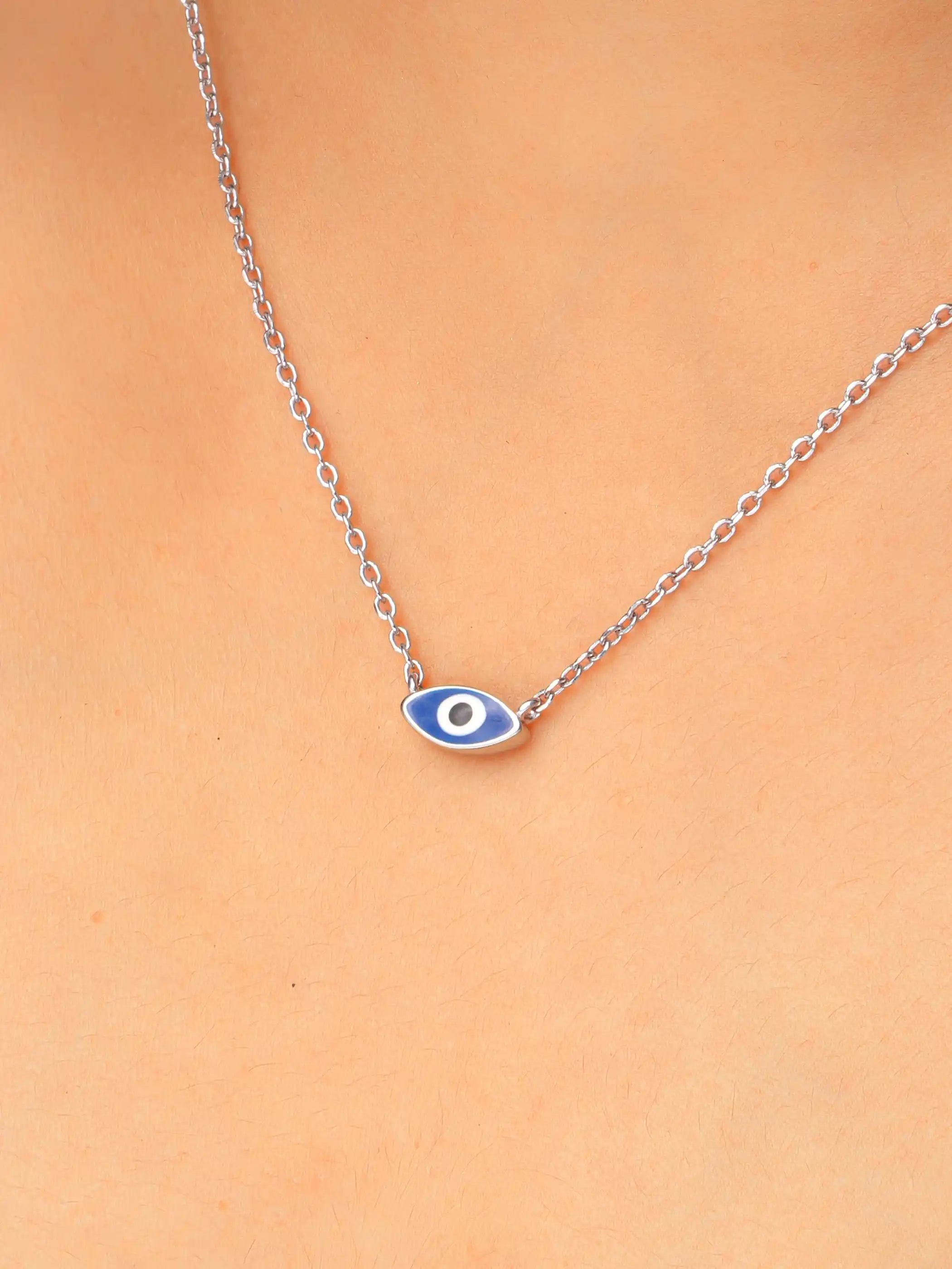 925 silver necklace with a dark blue evil eye charm on a fine chain, symbolizing protection and minimalist elegance