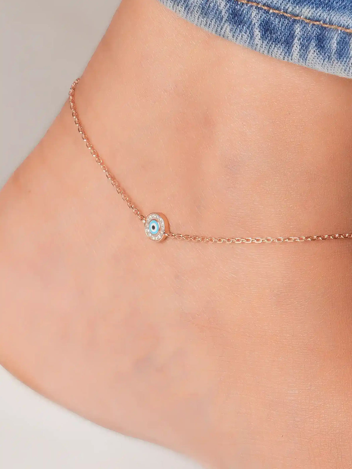 925 silver rose gold plated necklace with evil eye pendant, accented with blue enamel center and cubic zirconia border