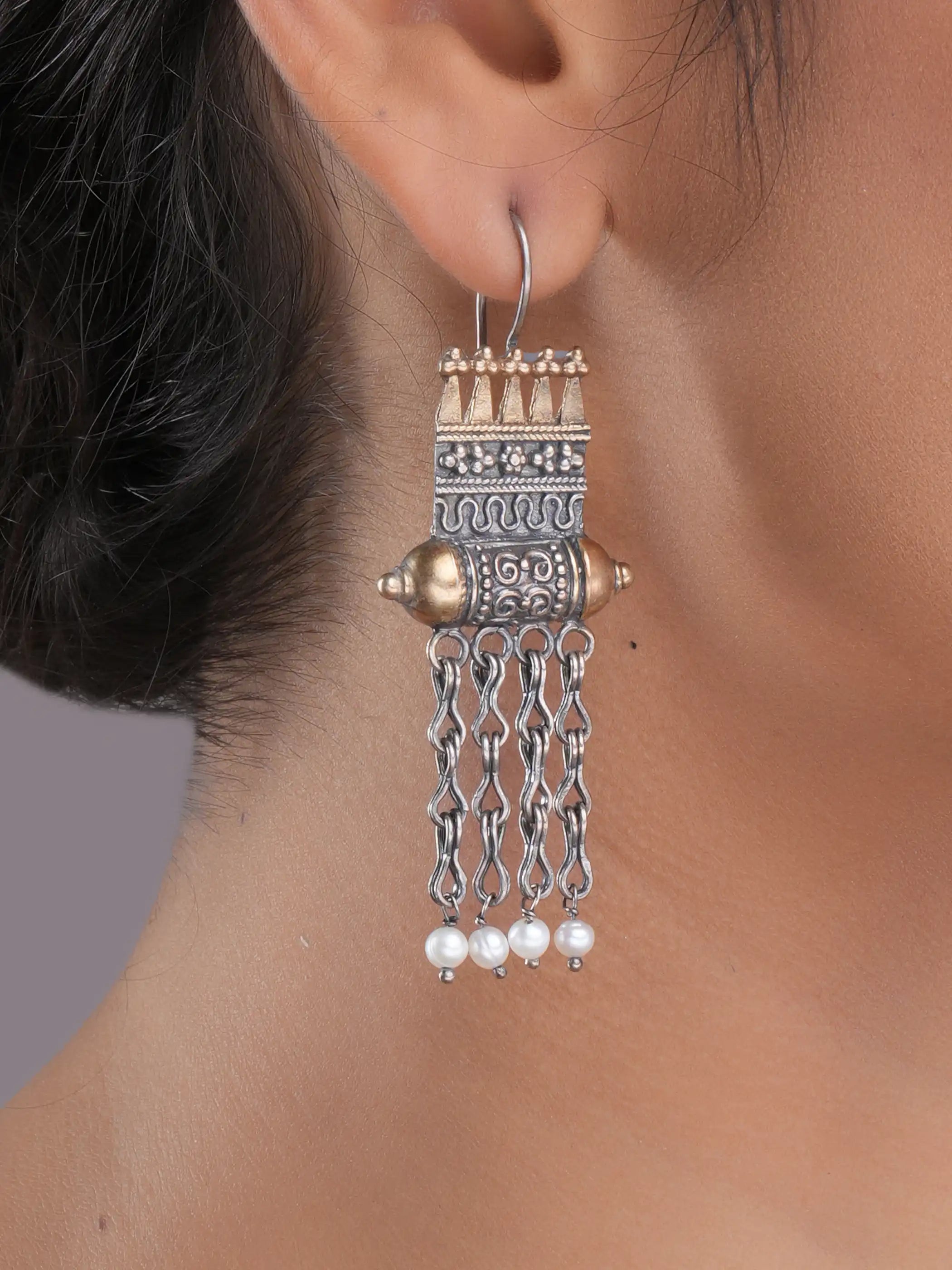 925 silver temple motif drop earrings with gold accents, oxidized detailing, and dangling pearl chains