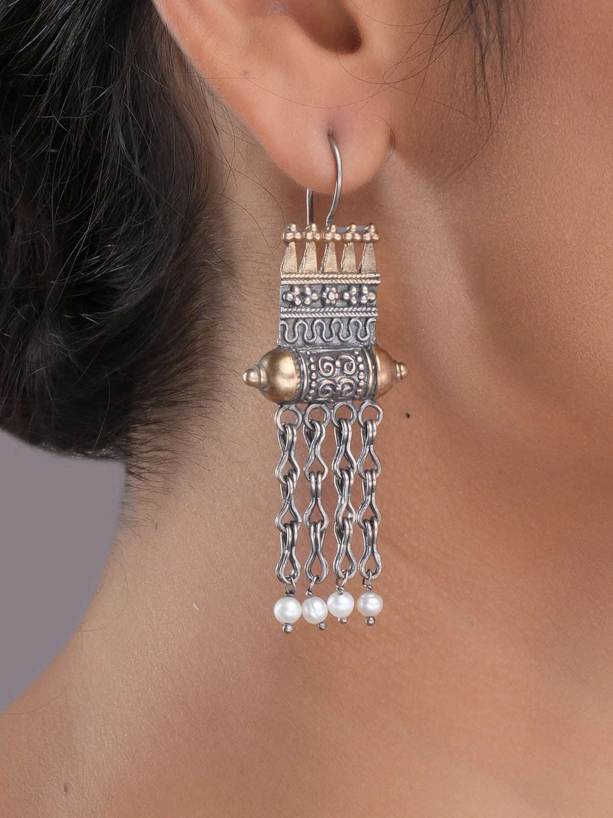 925 silver temple motif drop earrings with gold accents, oxidized detailing, and dangling pearl chains