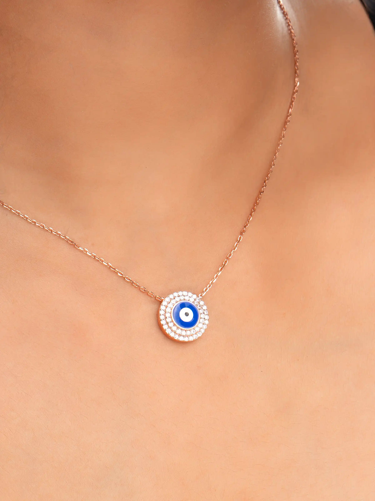 925 silver rose gold plated necklace with round blue evil eye pendant surrounded by sparkling crystals for chic everyday protection